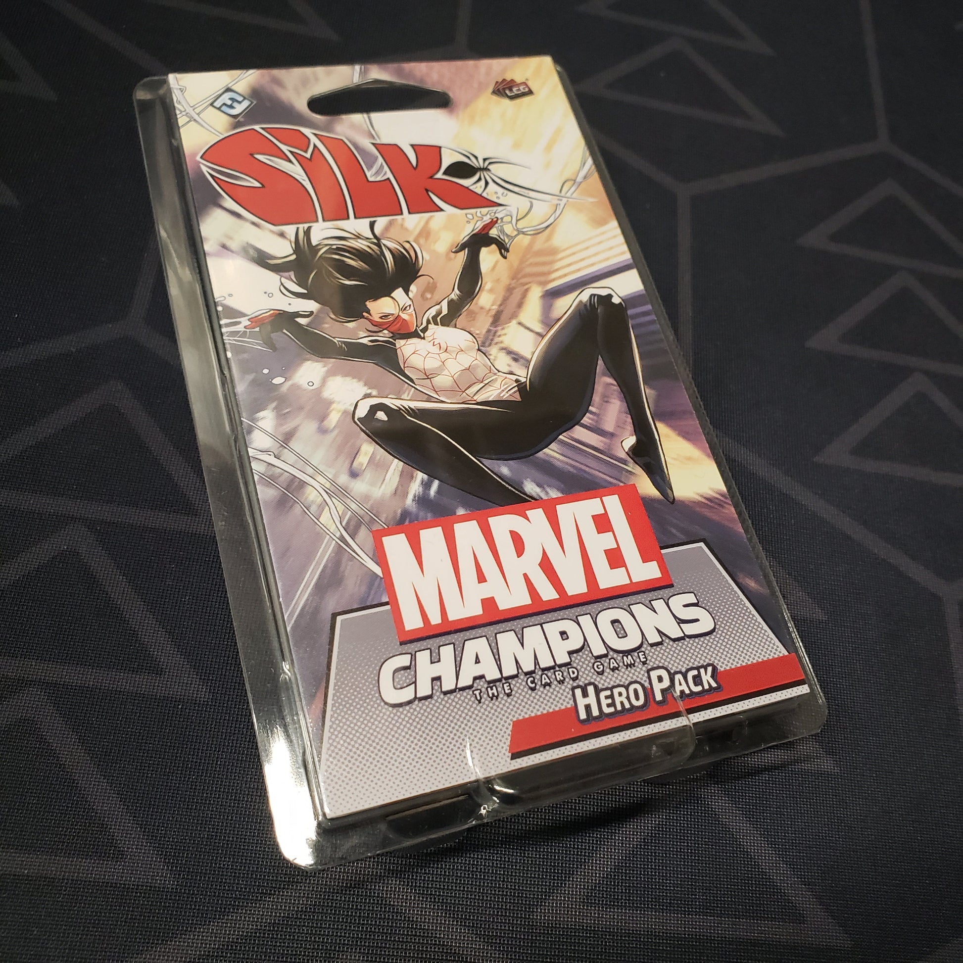 Image shows the front of the package of the Silk Hero pack for the card game Marvel Champions