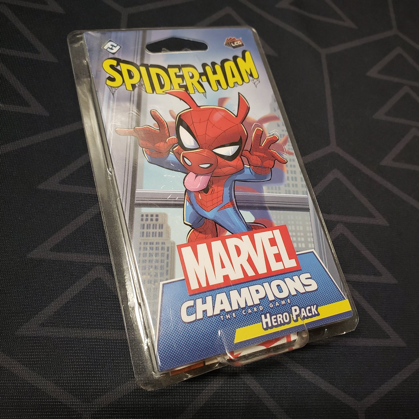 Image shows the front of the package for the Spider-Ham Hero Pack for the Marvel Champions card game