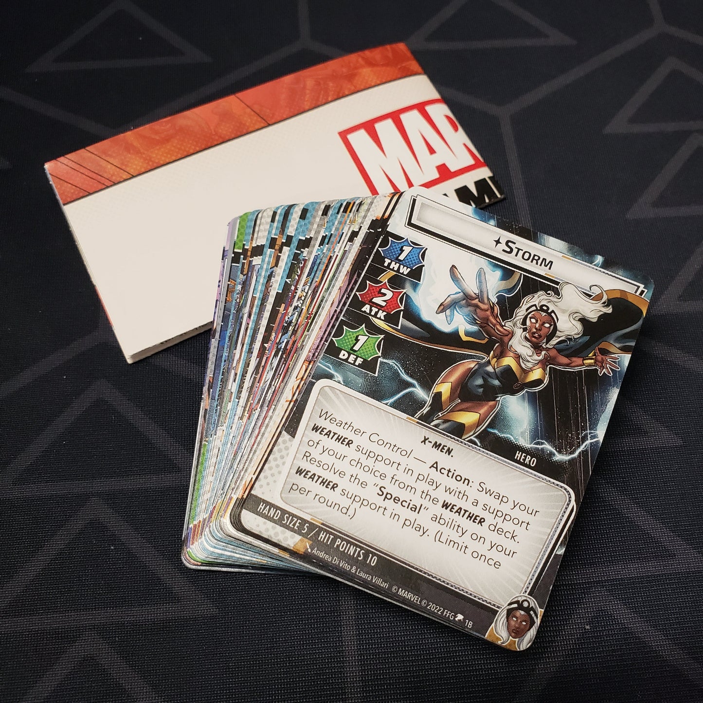 Image shows the cards & instruction sheet for the Storm Hero Pack from the Marvel Champions card game