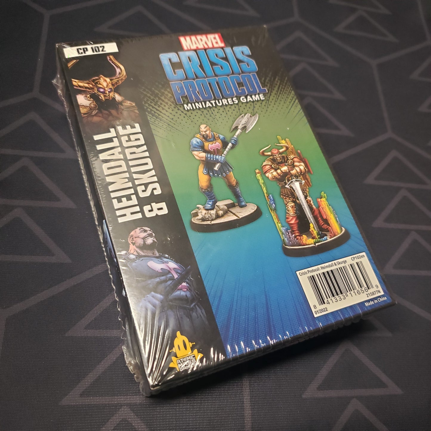 Image shows the front cover of the box of the Heimdall & Skurge pack for the miniatures game Marvel Crisis Protocol
