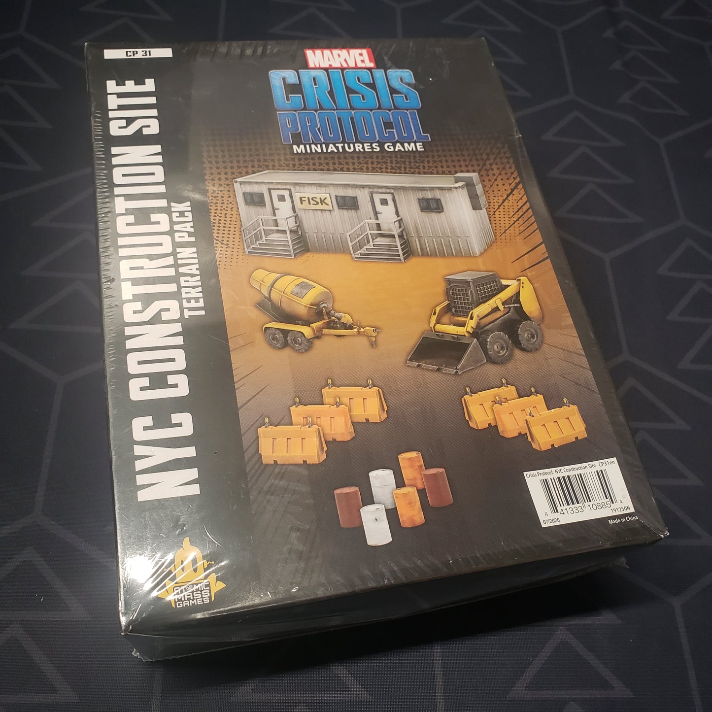 Image shows the front cover of the box of the NYC Construction Site Terrain Pack for the miniatures game Marvel Crisis Protocol