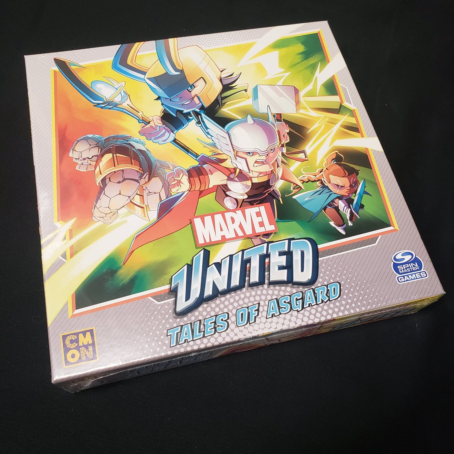 Image shows the front cover of the box for the Tales of Asgard expansion for the board game Marvel United
