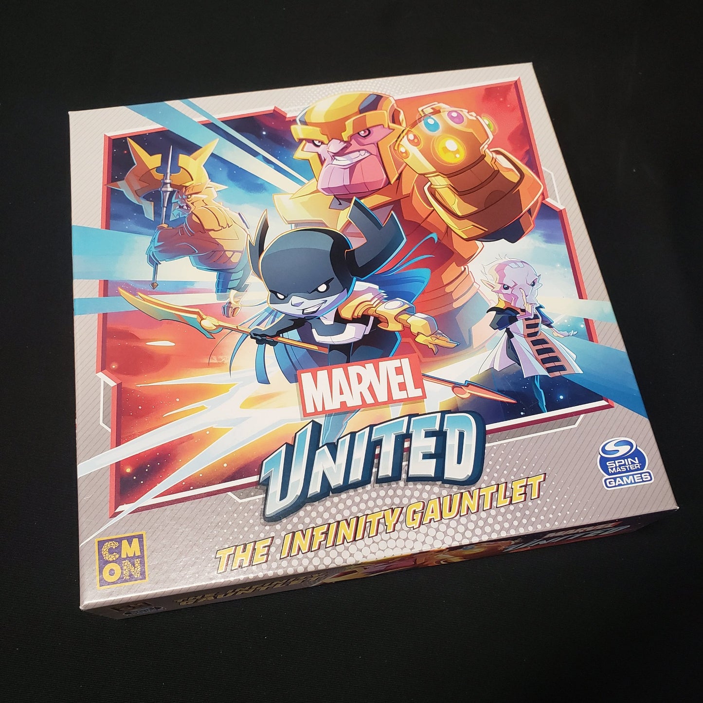Image shows the front cover of the box for the Infinity Gauntlet expansion for the board game Marvel United