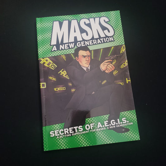 Image shows the front cover of the Secrets of A.E.G.I.S. book for the Masks: A New Generation roleplaying game
