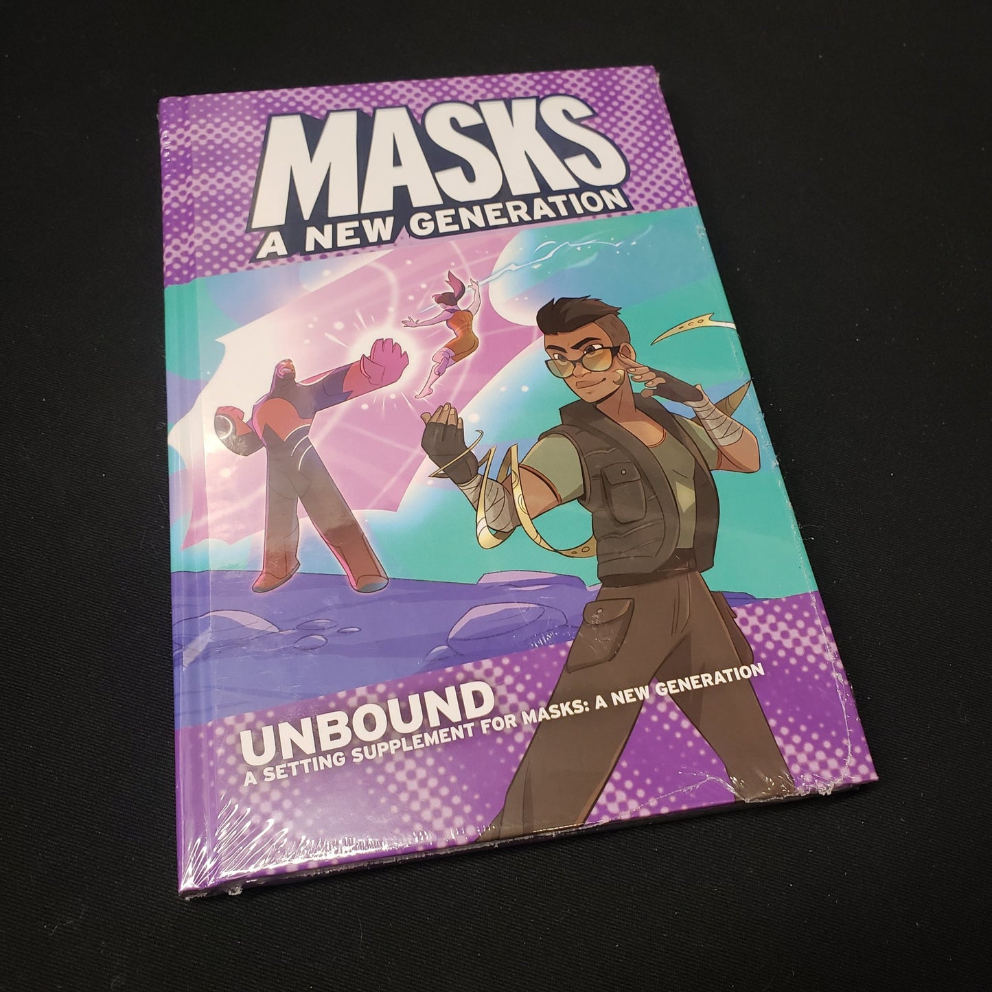 Image shows the front cover of the Unbound book for the Masks: A New Generation roleplaying game