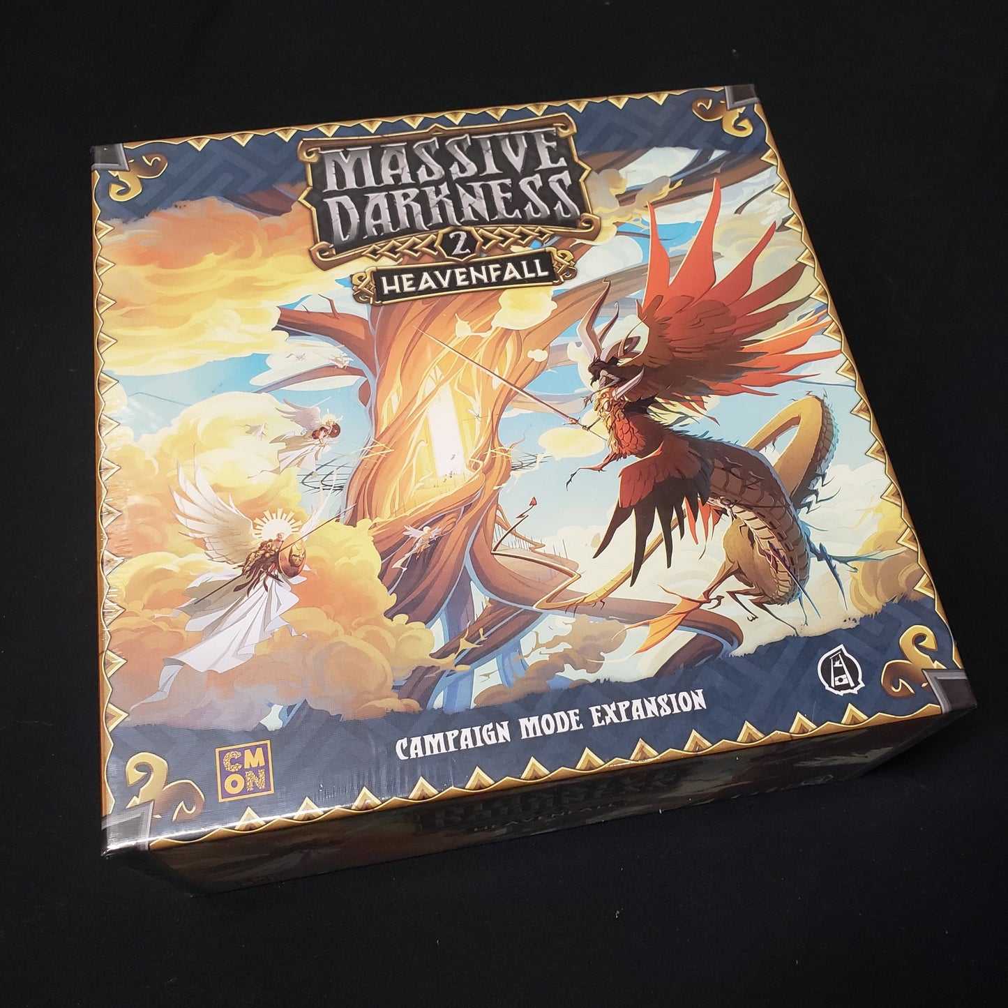 Image shows the front cover of the box of the Heavenfall Campaign expansion for the board game Massive Darkness 2: Hellscape