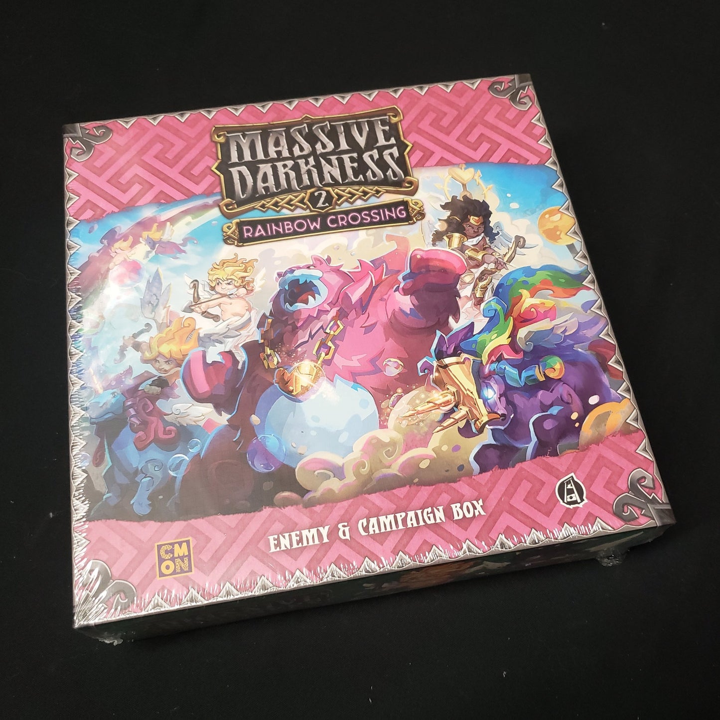 Image shows the front cover of the box of the Rainbow Crossing Enemy & Campaign Box expansion for the board game Massive Darkness 2: Hellscape