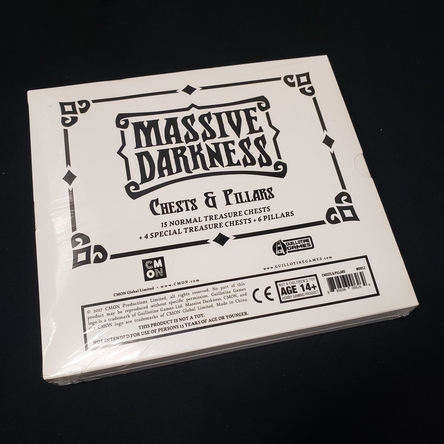 Image shows the front cover of the box of the Chests & Pillars add-on pack for the board game Massive Darkness
