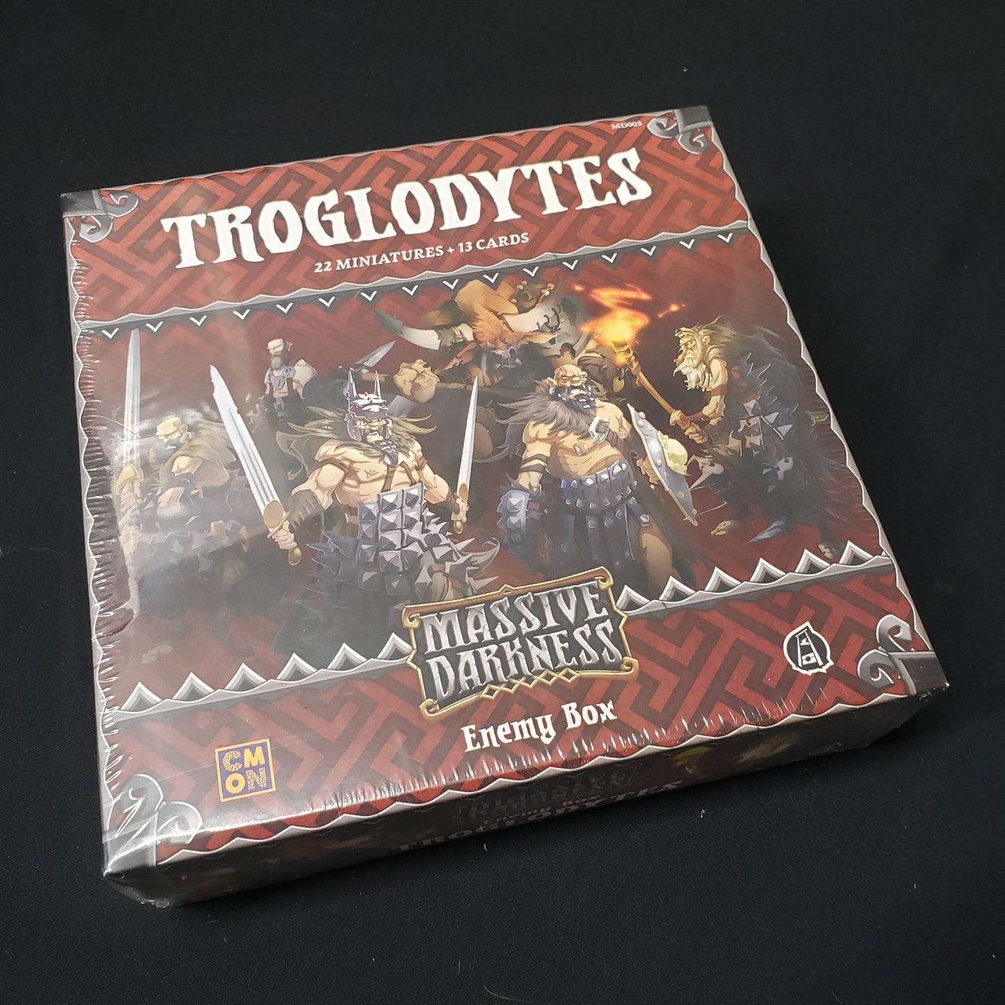 Image shows the front cover of the box of the Troglodytes Enemy Box expansion for the board game Massive Darkness