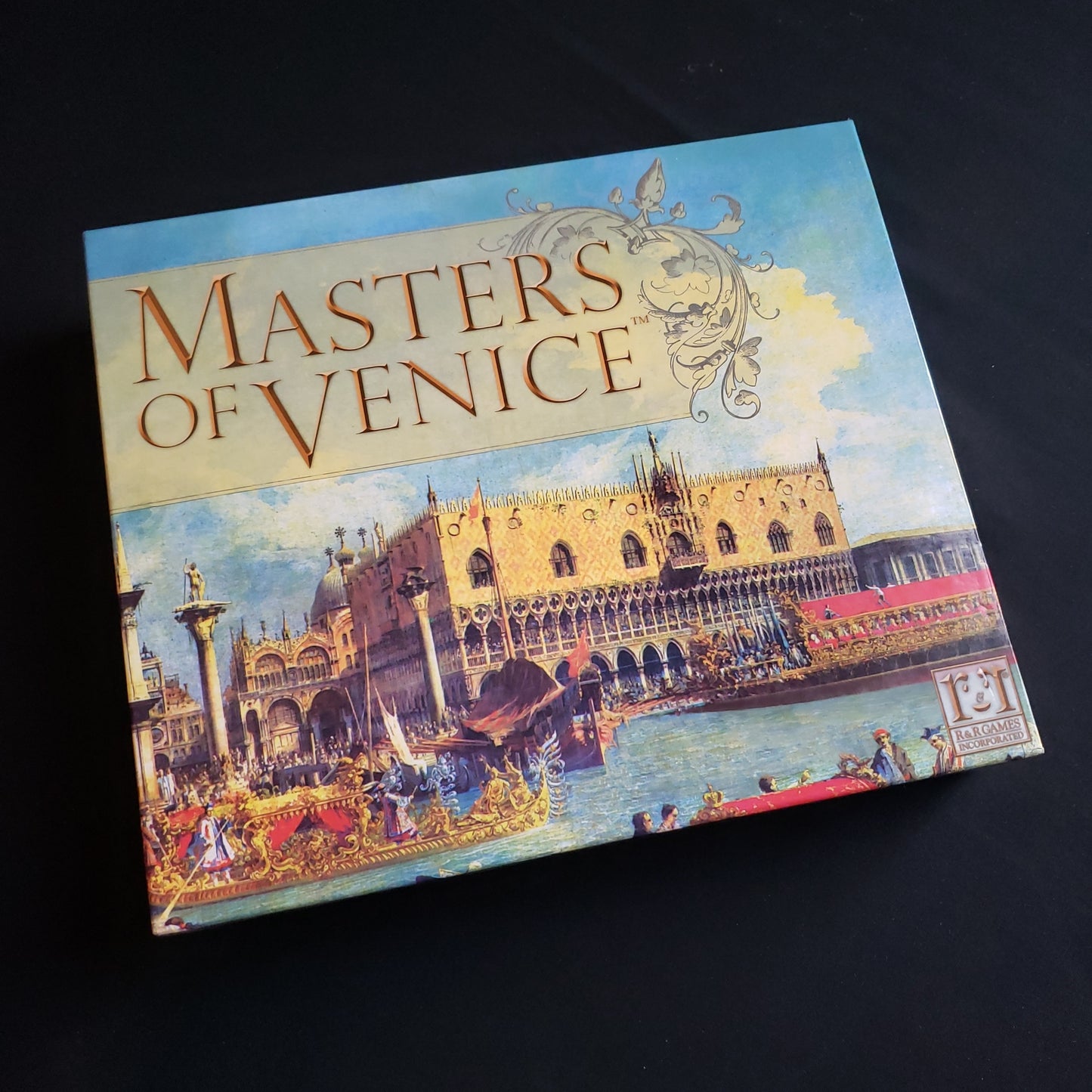 Image shows the front cover of the box of the Masters of Venice board game