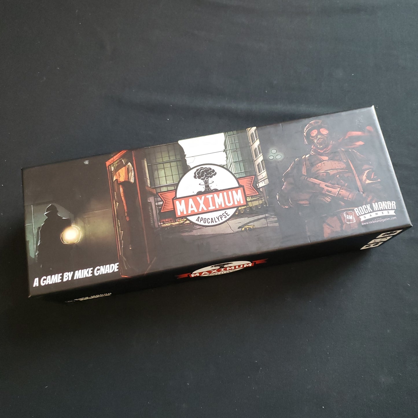 Image shows the front cover of the box of the Maximum Apocalypse card game