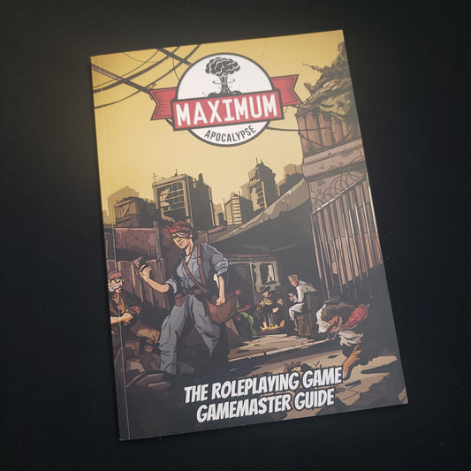 Image shows the front cover of the Gamemaster Guide book for the Maximum Apocalypse roleplaying game