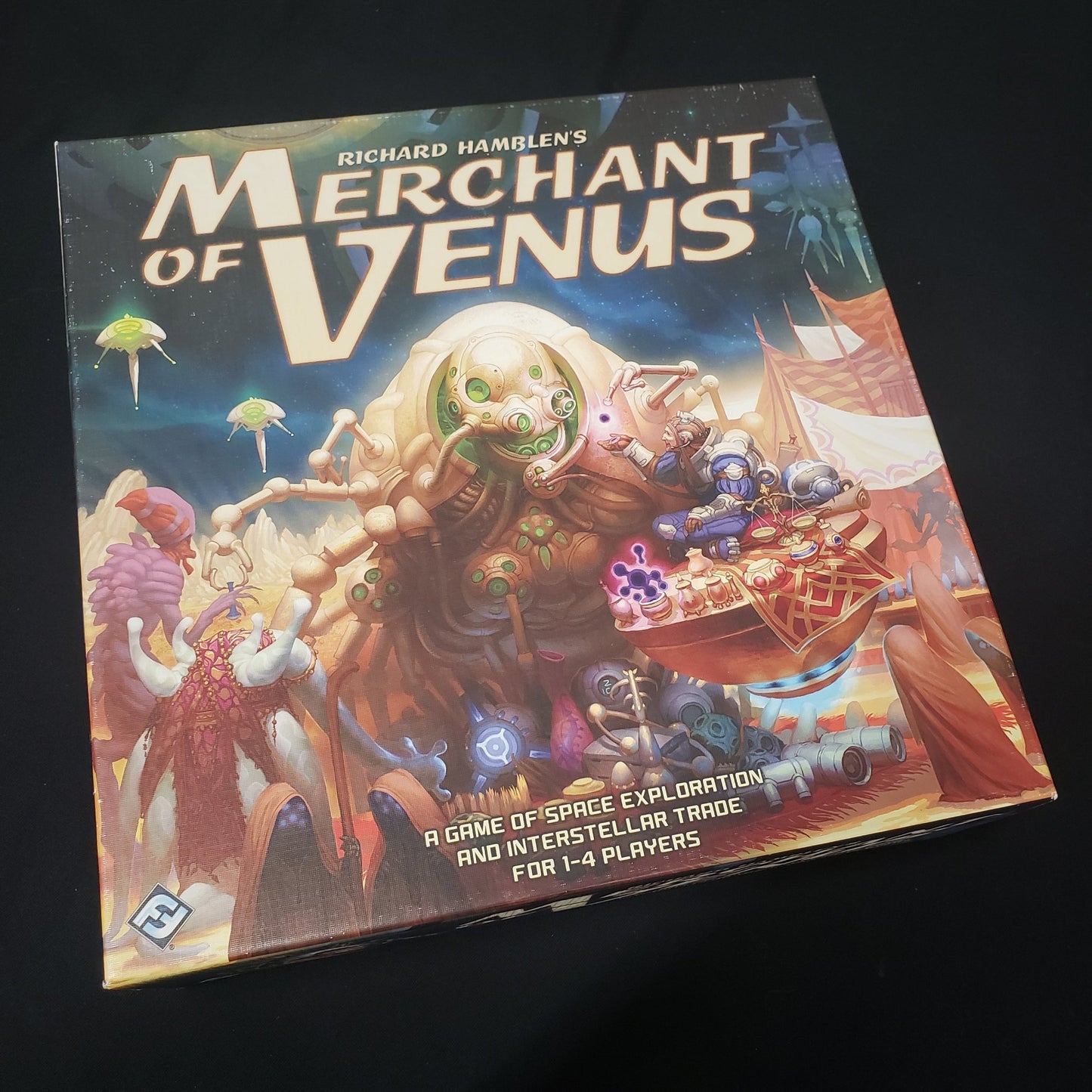 Image shows the front cover of the box of the Merchant of Venus board game