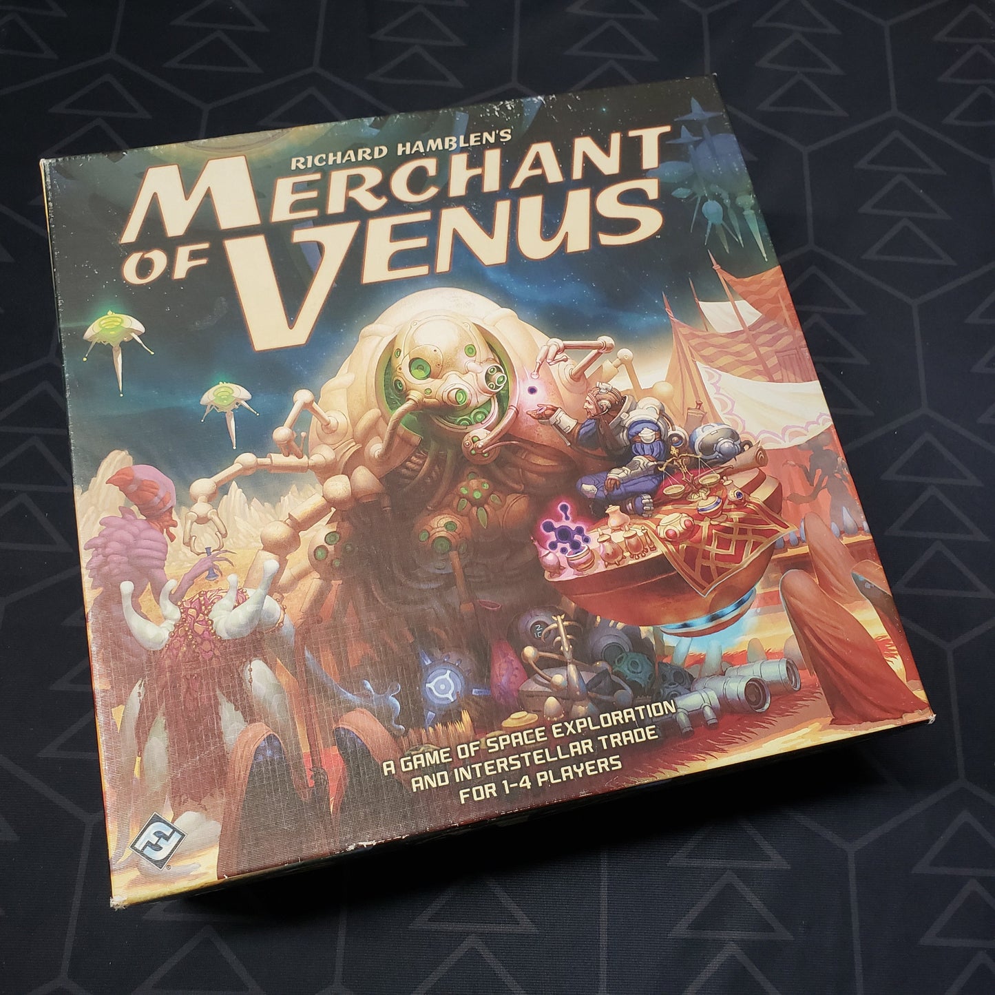 Image shows the front cover of the box of the Merchant of Venus board game