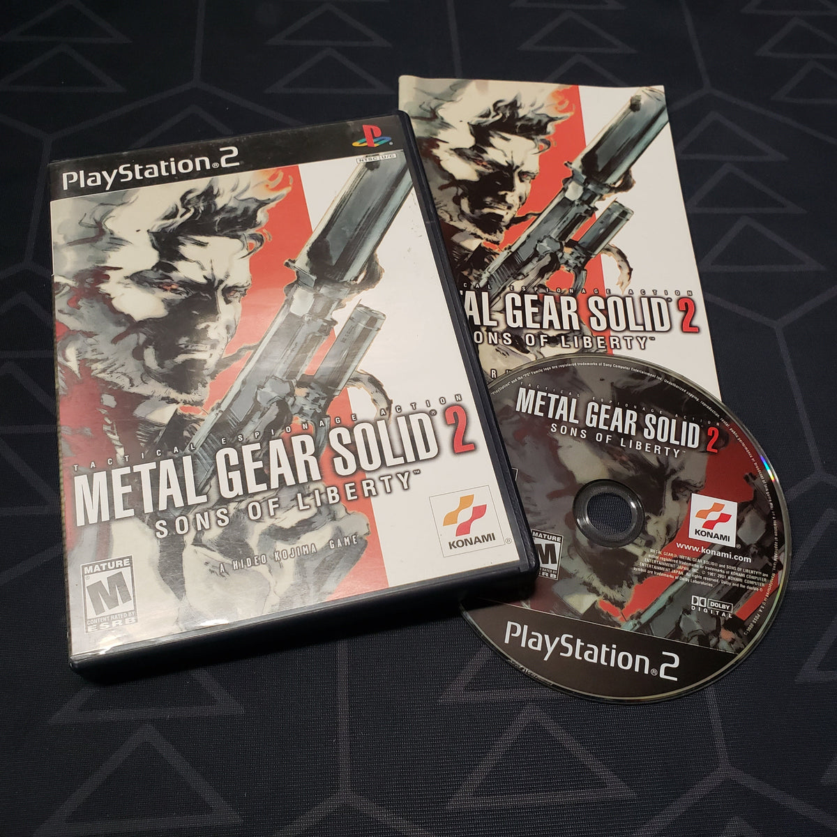 Image shows the case, manual & disc for the video game Metal Gear Solid 2: Sons of Liberty for Playstation 2