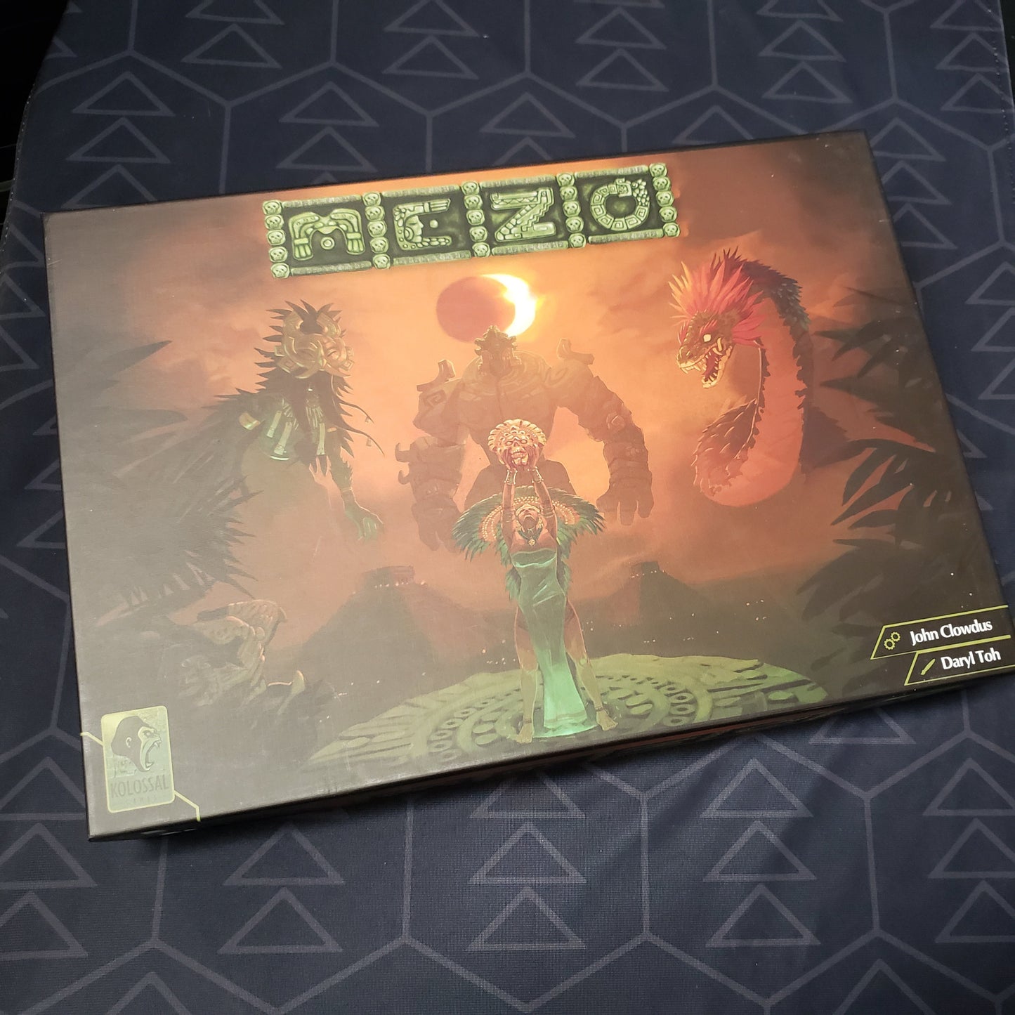 Image shows the front cover of the box for the Mezo board game