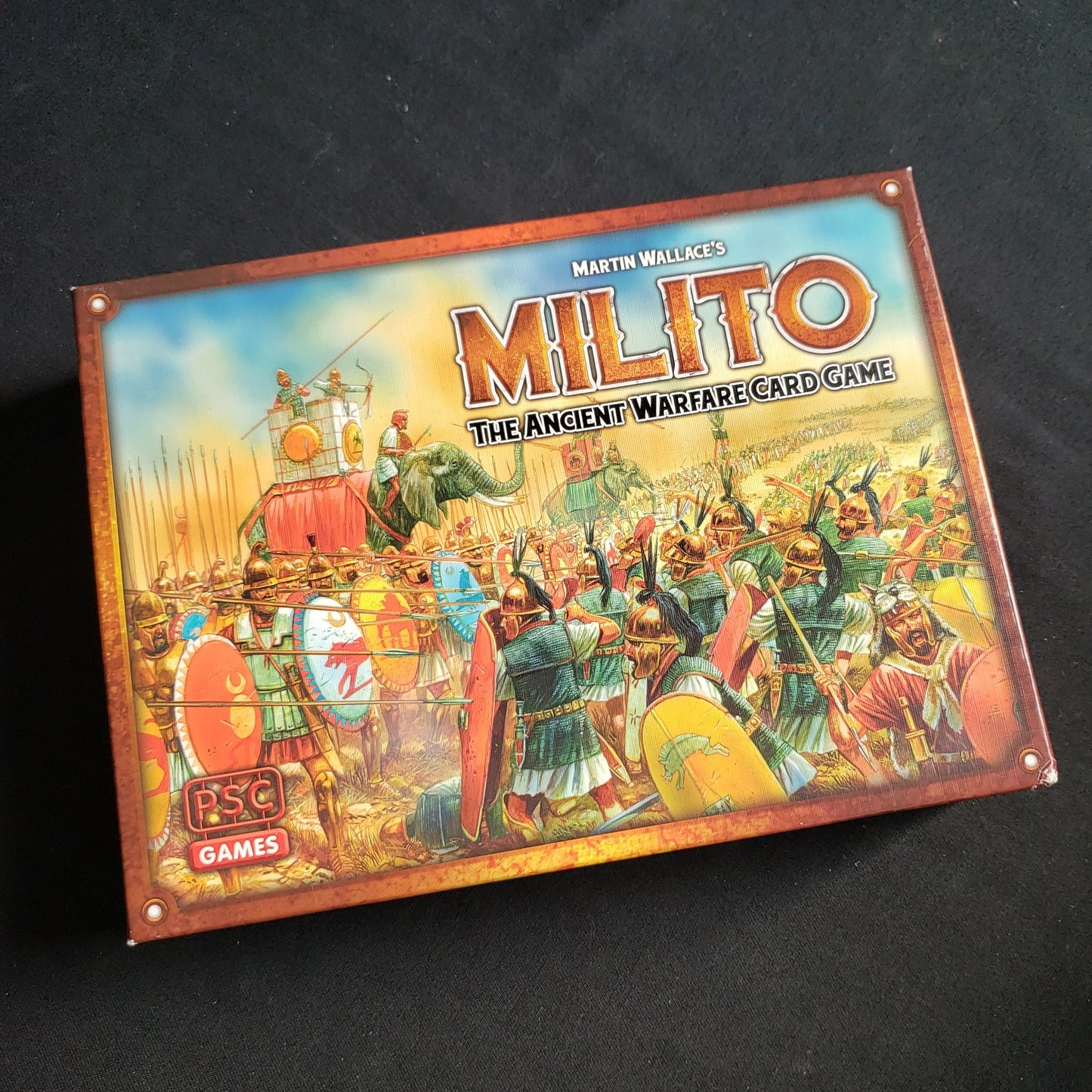 Image shows the front cover of the box of the Milito card game