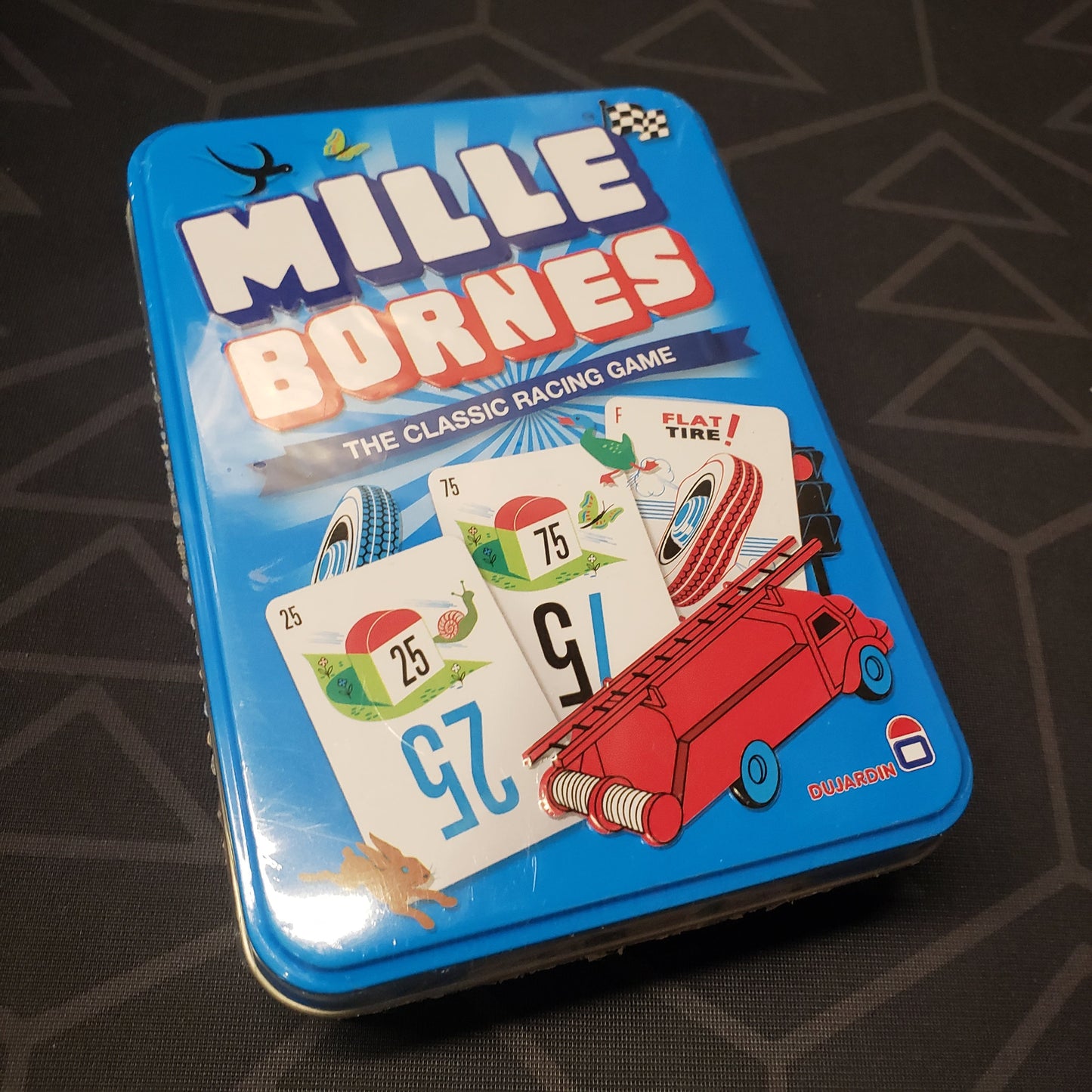 Image shows the front cover of the box for the Mille Bornes card game