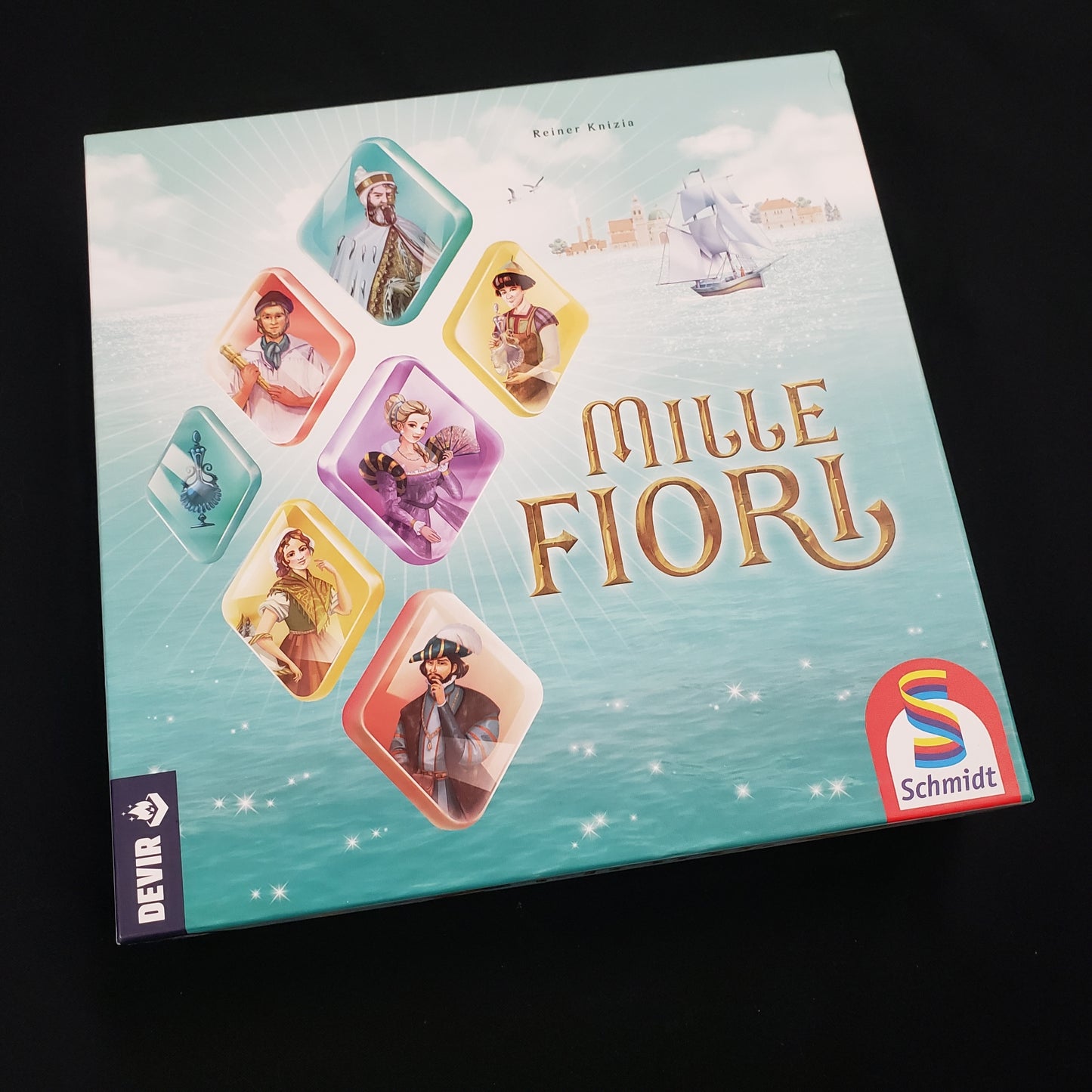 Image shows the front cover of the box of the Mille Fiori board game