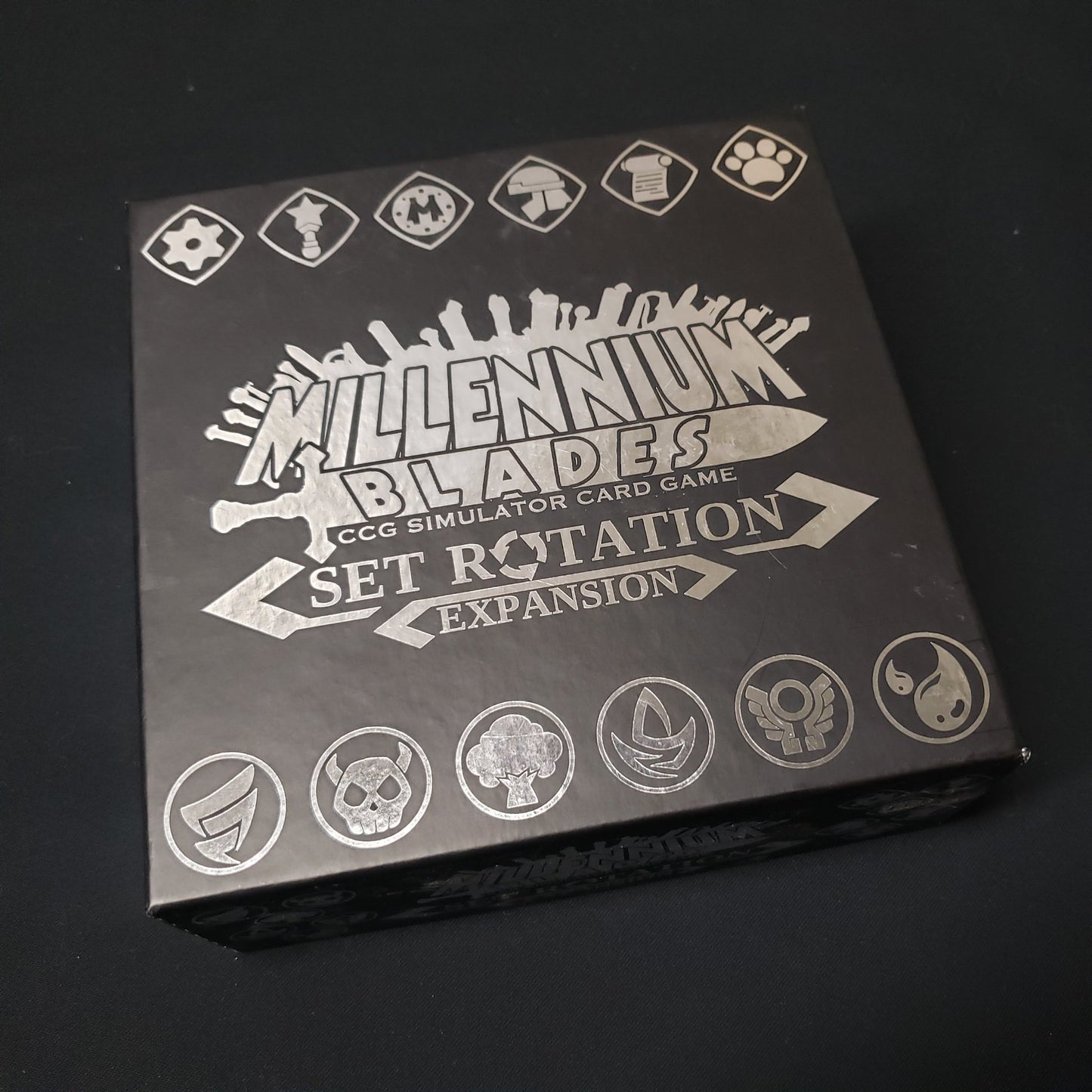 Image shows the front cover of the box of the Set Rotation expansion for the card game Millennium Blades
