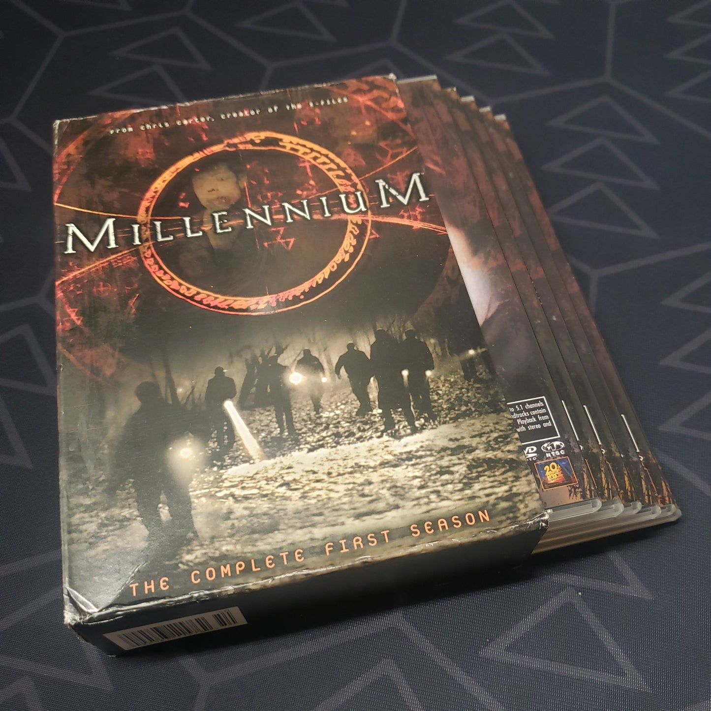 Image shows the outer box with the disc cases fanned out for Millennium: Season 1 on DVD