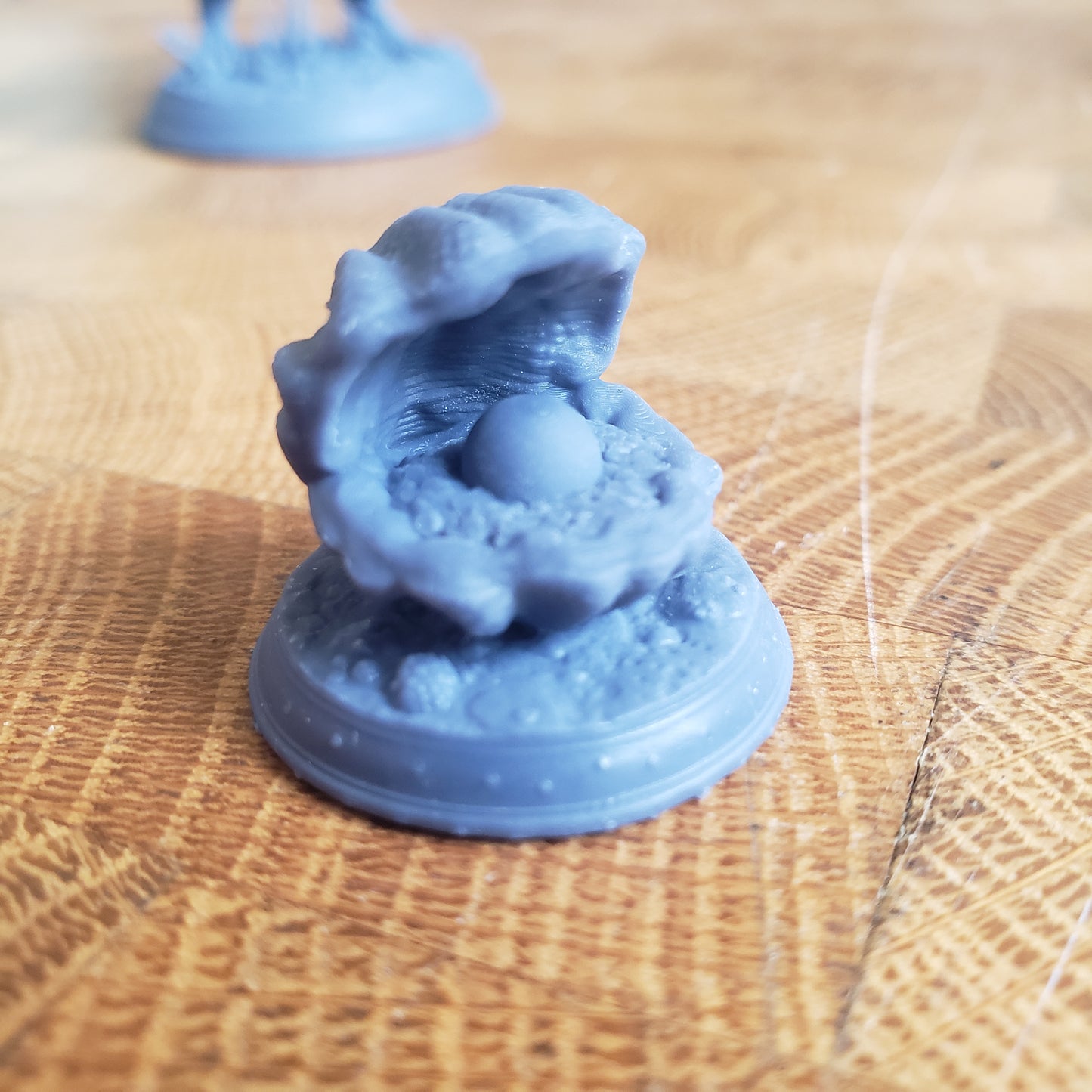 Image is a photo of a 3D printed clam mimic gaming miniature printed in-house at All Systems Go