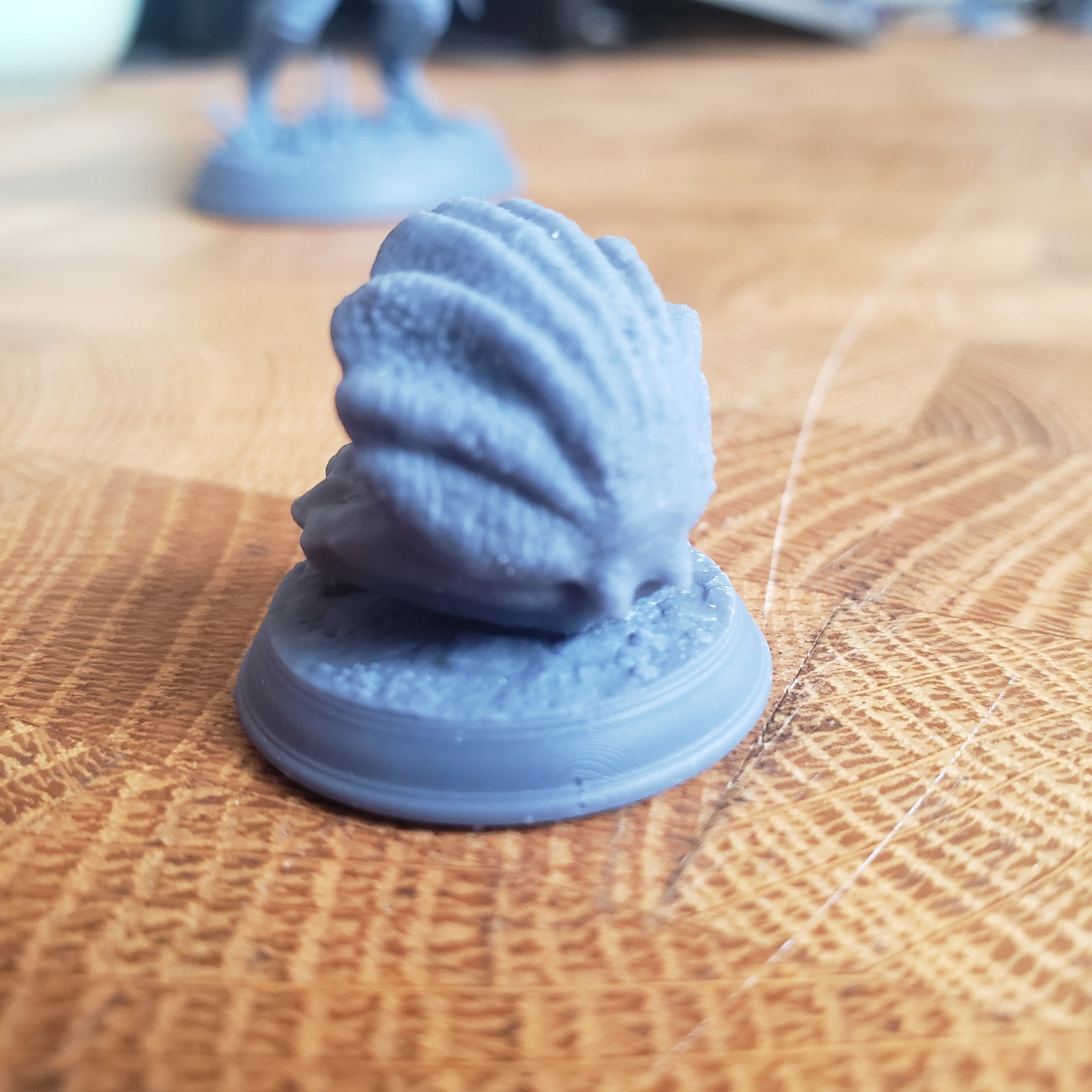Image is a photo of a 3D printed clam mimic gaming miniature printed in-house at All Systems Go