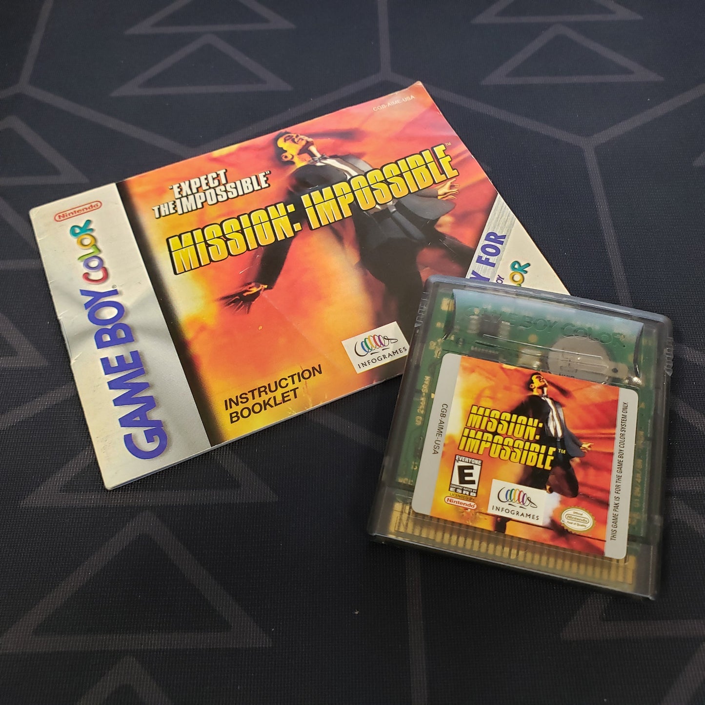 Image shows the manual & cartridge for the video game Mission: Impossible for Nintendo Game Boy Color