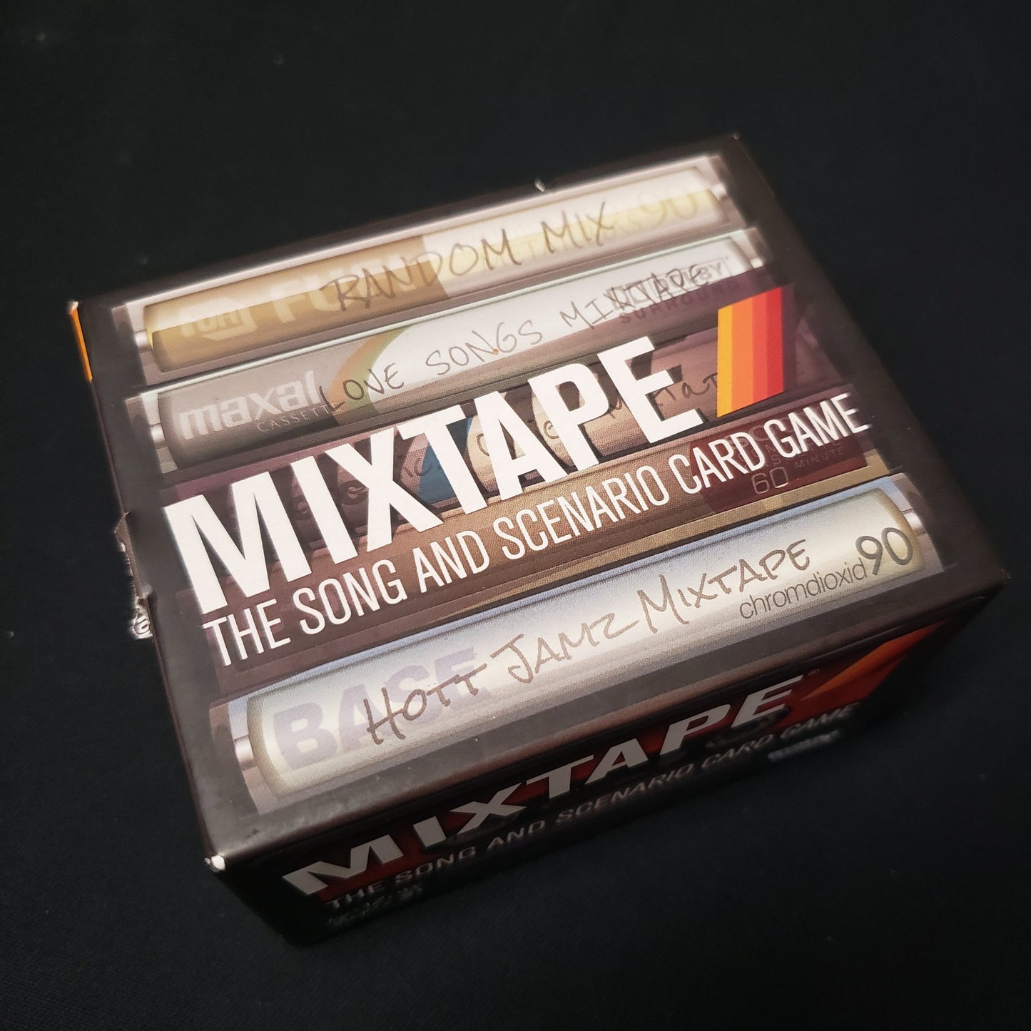 Image shows the front cover of the box of the Mixtape card game