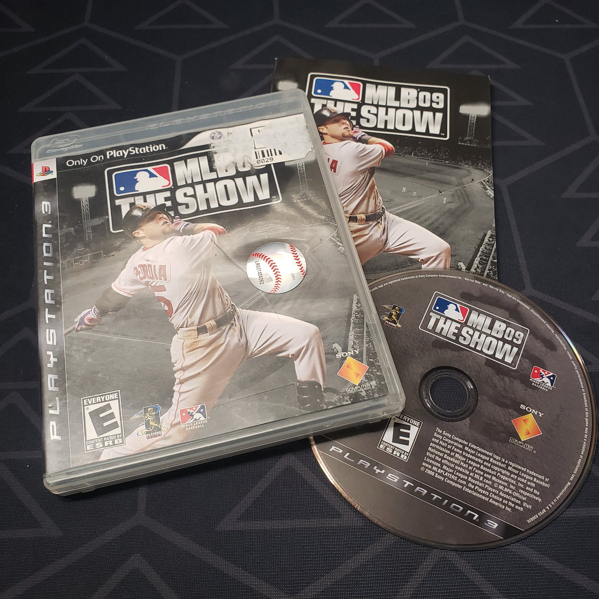 Image shows the case, manual and disc for the video game MLB 09: The Show for Playstation 3
