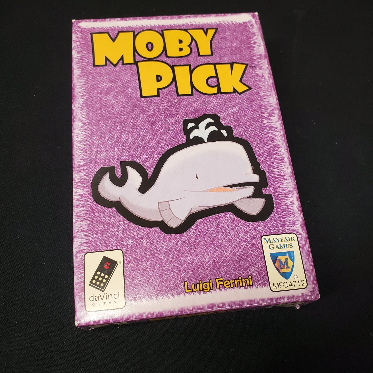 Image shows the front cover of the box of the Moby Pick card game