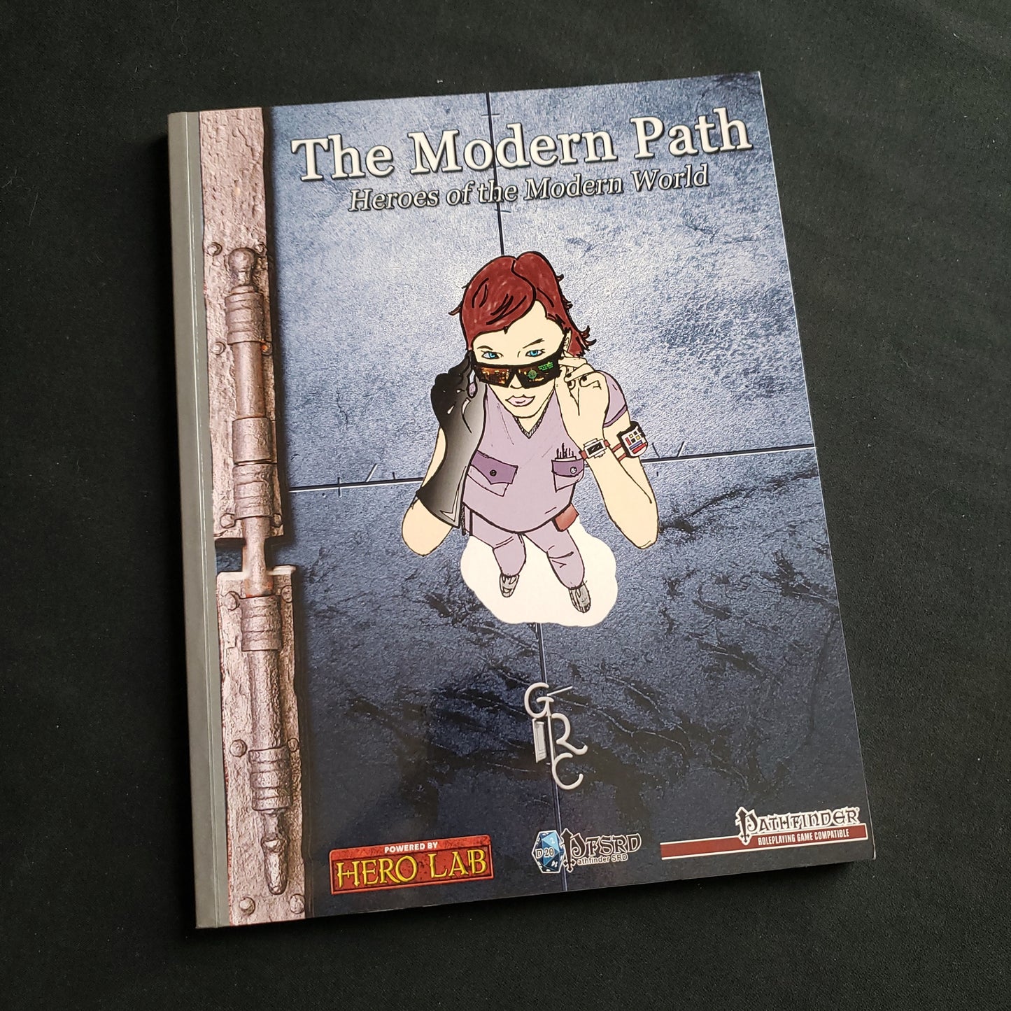 Image shows the front cover of the Modern Path: Heroes of the Modern World roleplaying game book