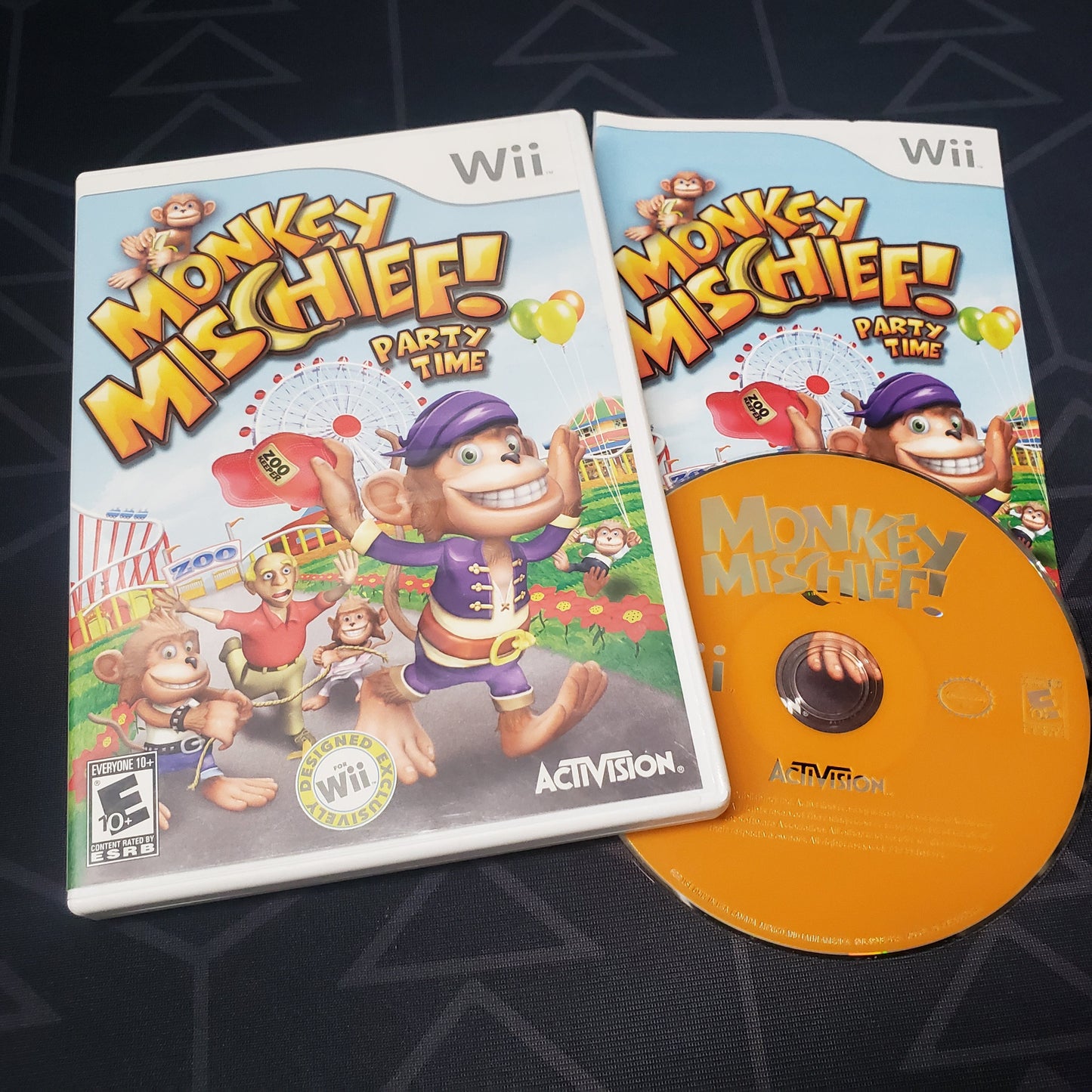 Image shows the case, manual & disc for the video game Monkey Mischief!: Party Time for Nintendo Wii