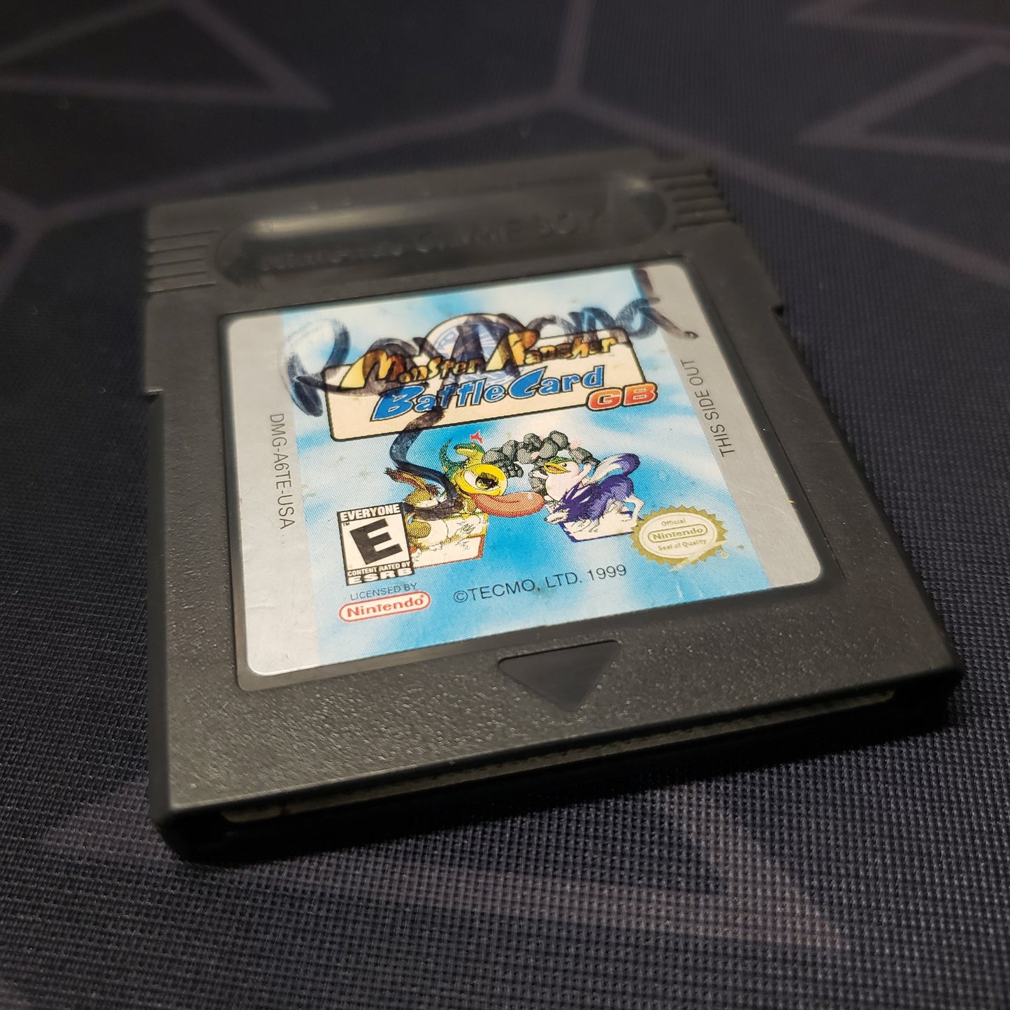 Image shows the front of the cartridge for the video game Monster Rancher: Battle Card GB for Nintendo Game Boy Color