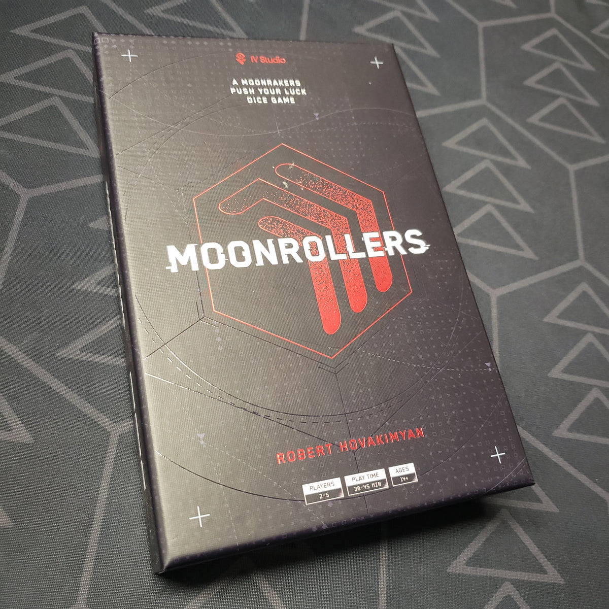 Image shows the front cover of the box for the Moonrollers board game