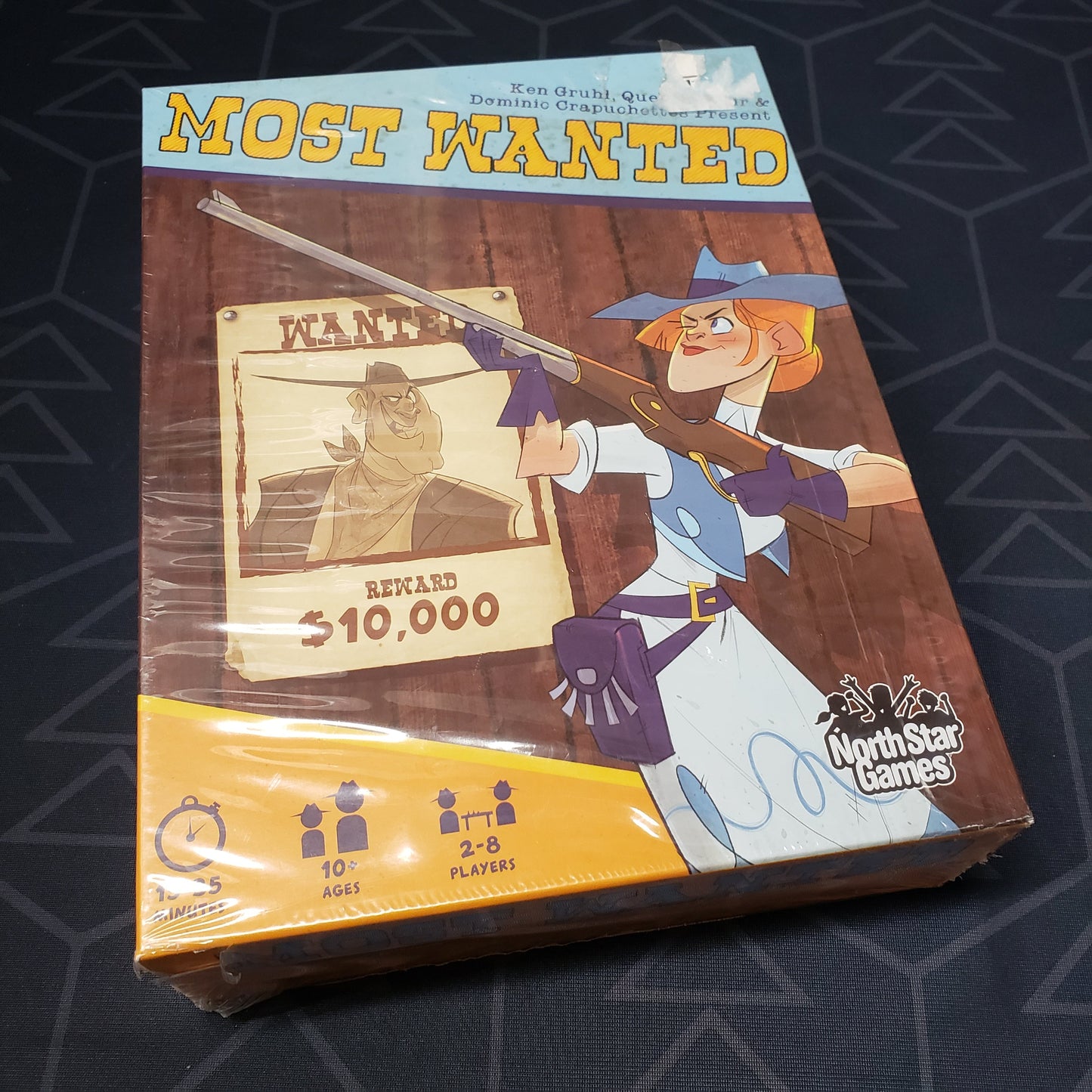 Image shows the front cover of the box of the Most Wanted card game
