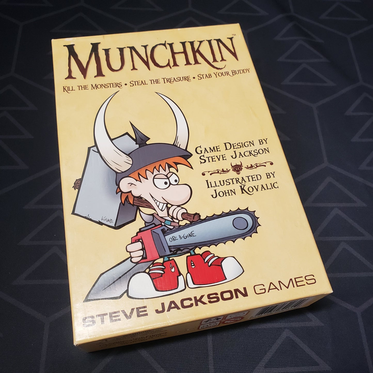 Image shows the front cover of the box of the Munchkin card game