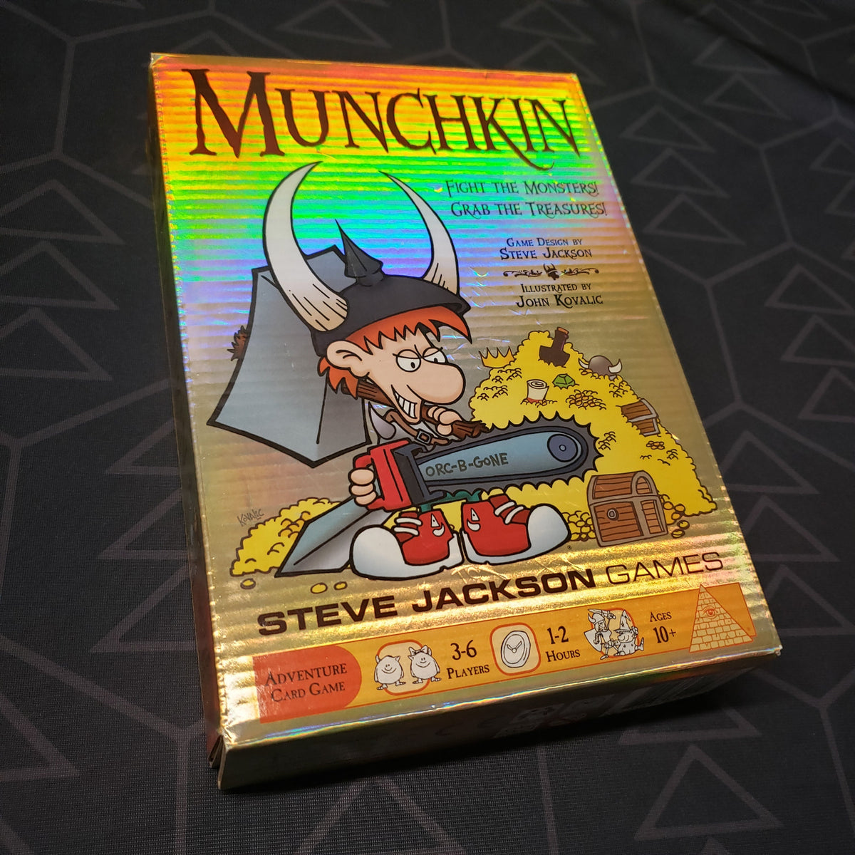 Image shows the front cover of the box of the Munchkin card game