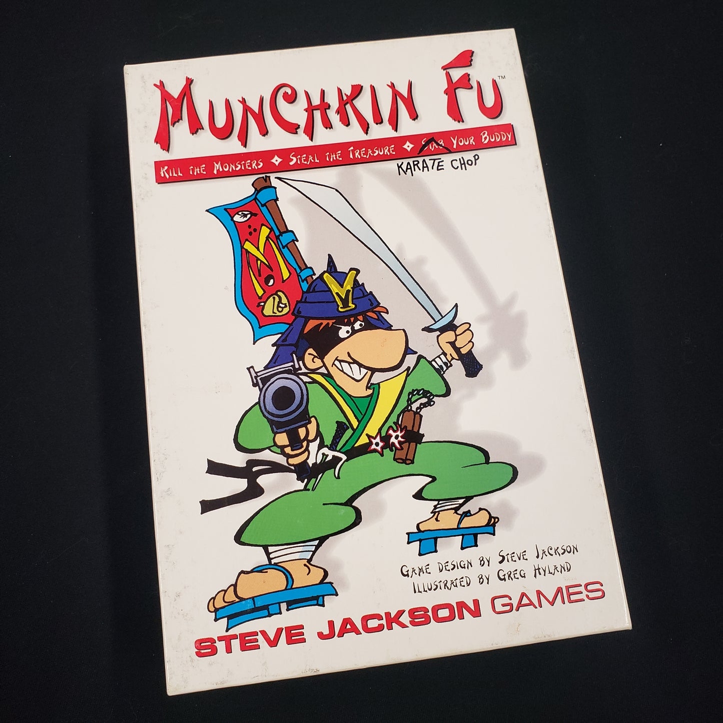Image shows the front cover of the box of the Munchkin Fu card game