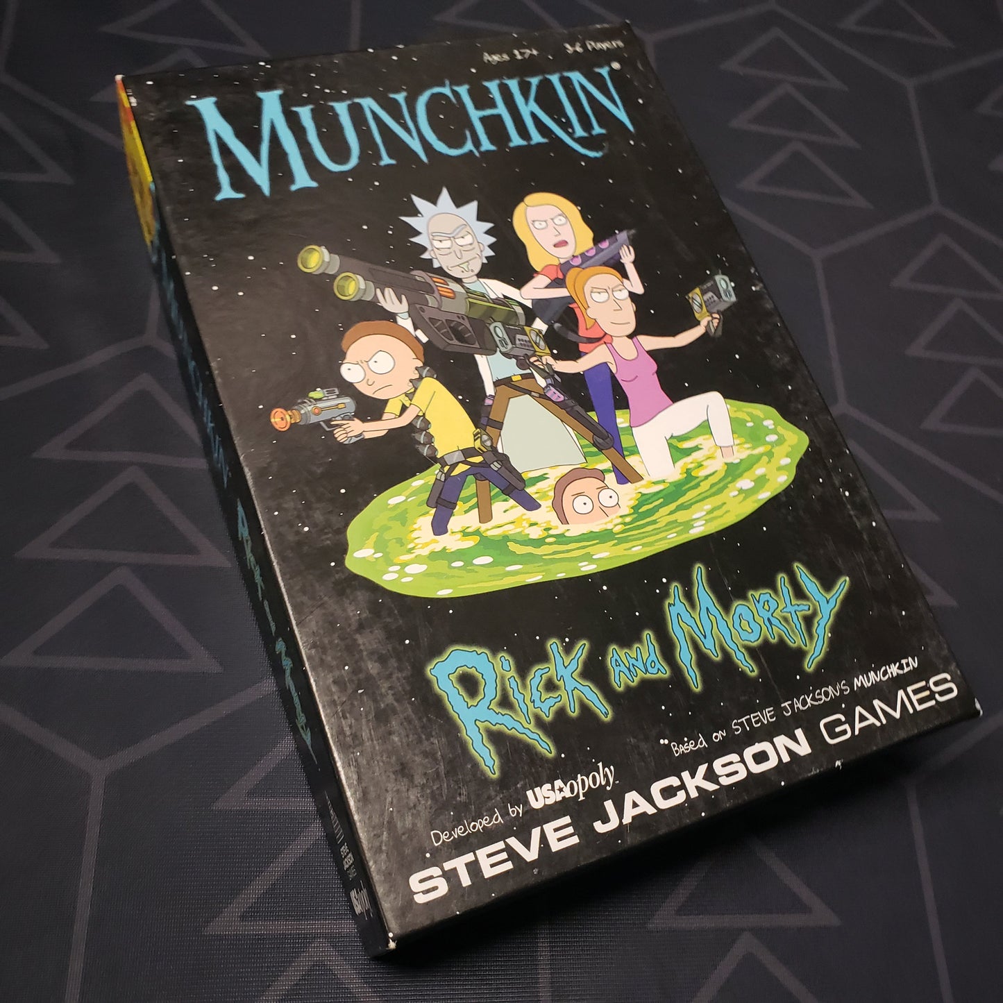 Image shows the front cover of the box of the Munchkin: Rick and Morty card game