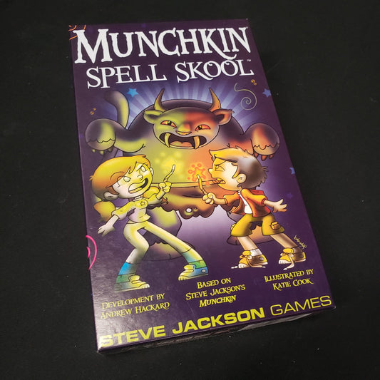 Image shows the front cover of the box of the Munchkin Spell Skool card game