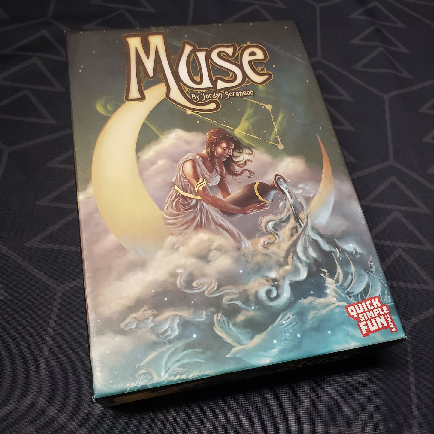 Image shows the front cover of the box of the Muse card game