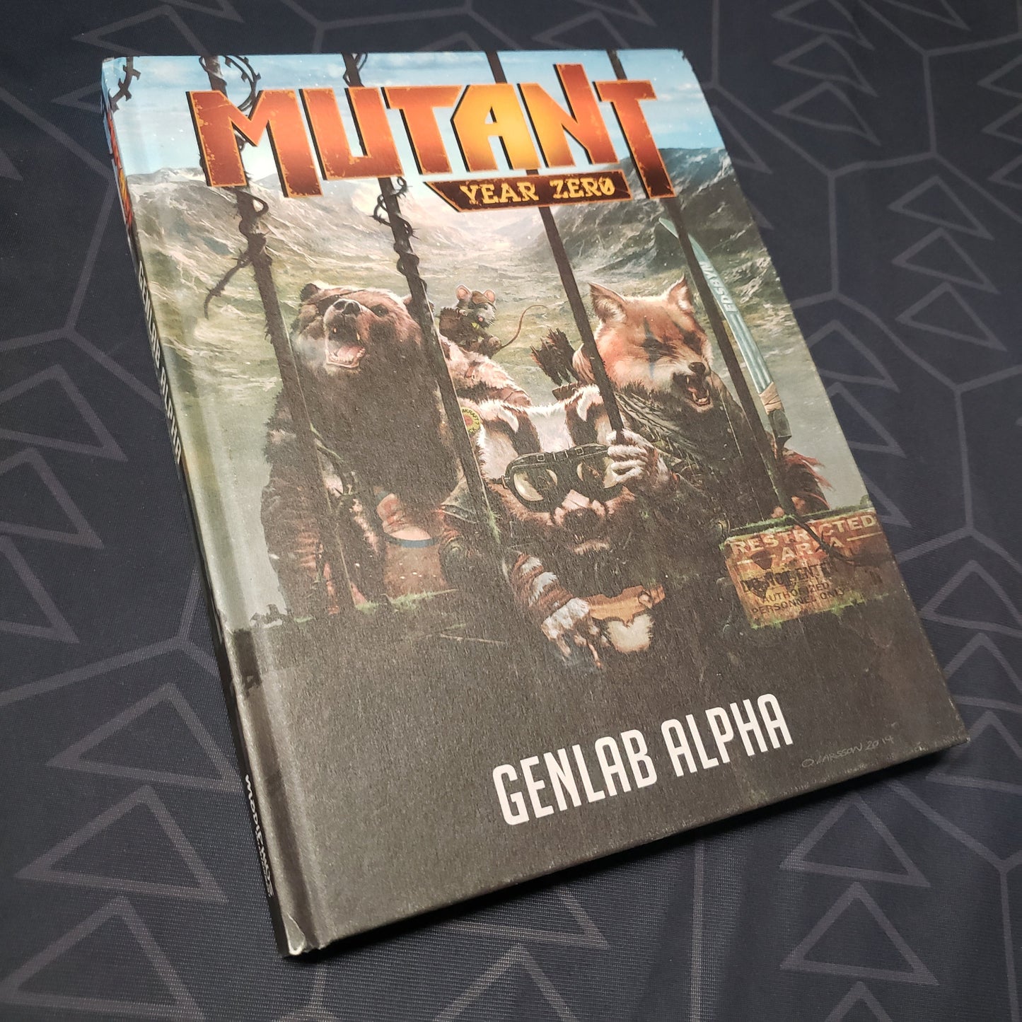 Image shows the front cover of the Genlab Alpha book for the roleplaying game Mutant: Year Zero