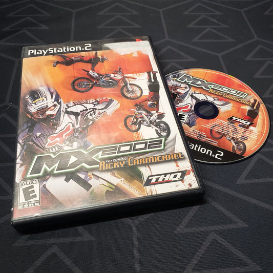 Image shows the case and disc for the video game MX 2002 Featuring Ricky Carmichael for Playstation 2