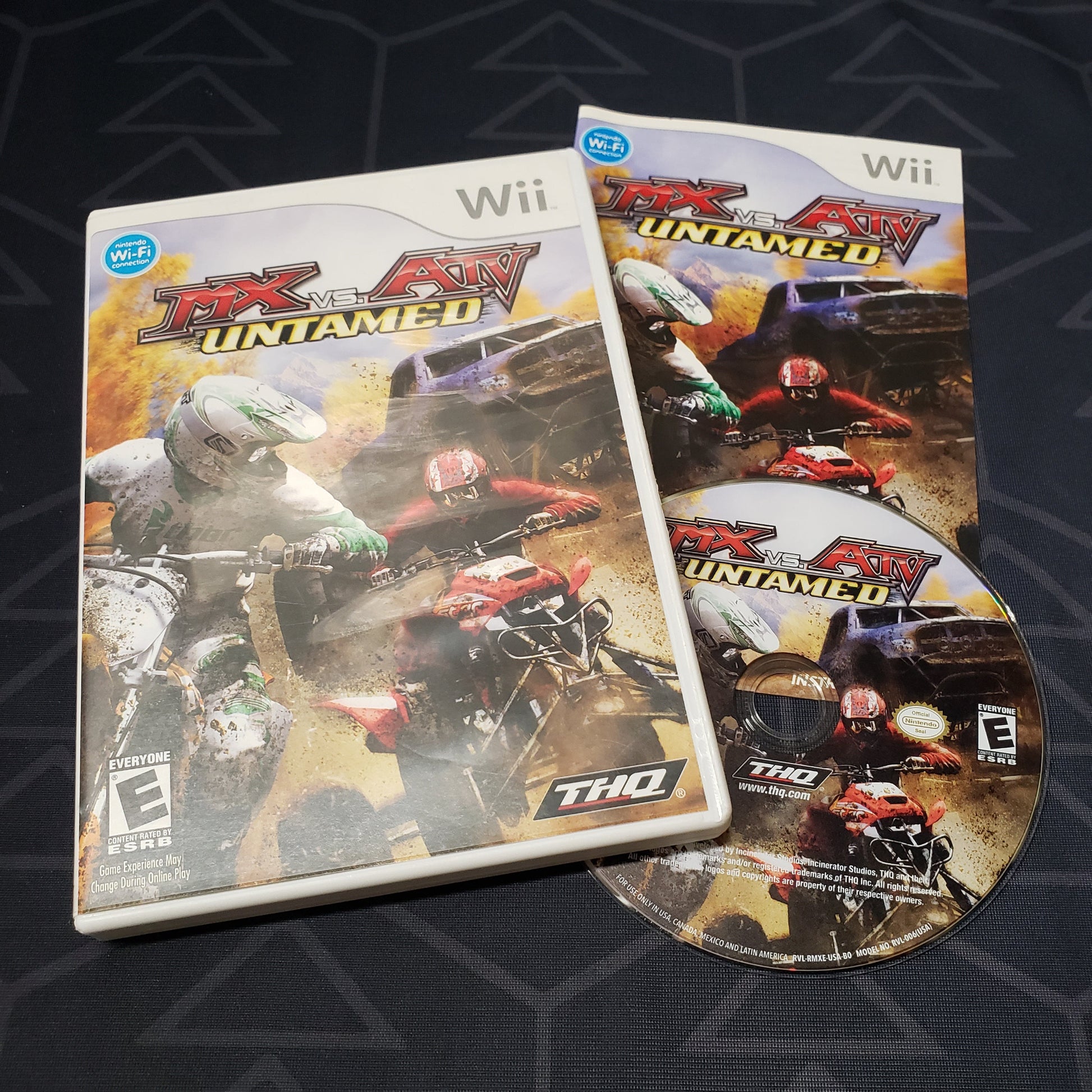 Image shows the case, manual and disc for the video game MX vs. ATV Untamed for Nintendo Wii