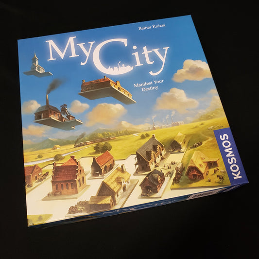 Image shows the front cover of the box of the My City board game