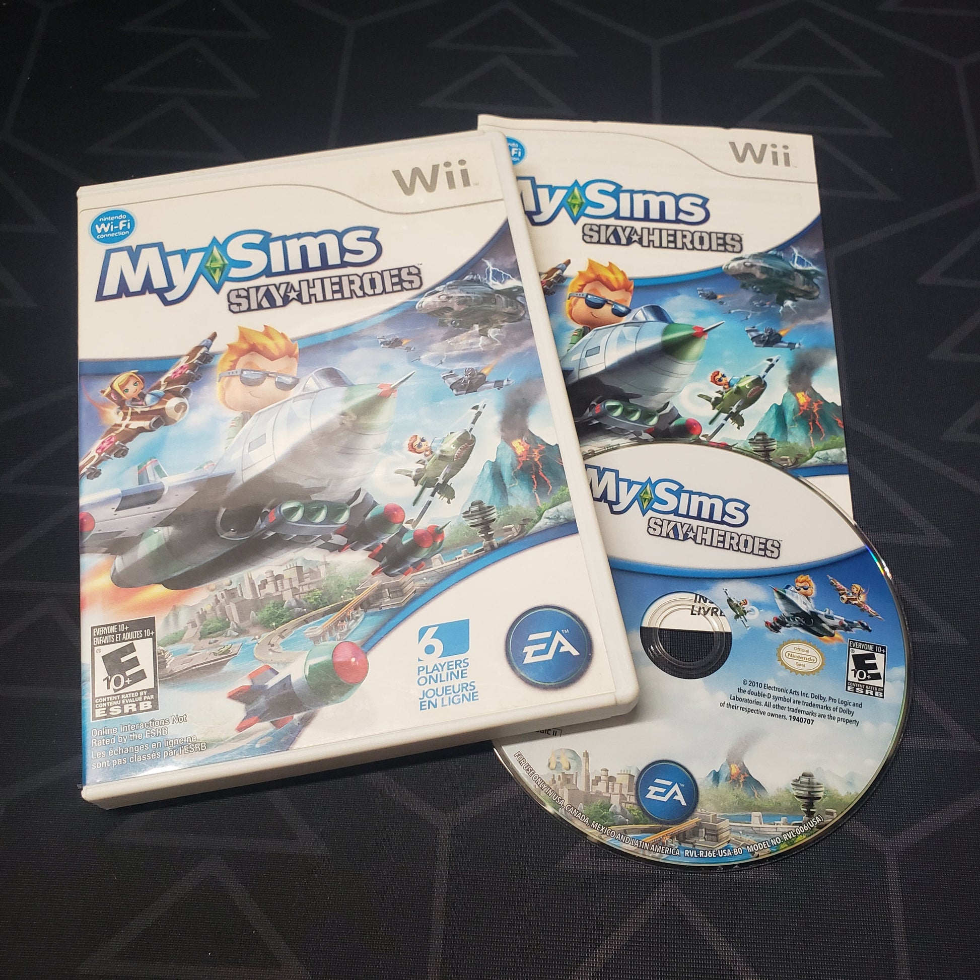 Image shows the case, manual and disc for the video game MySims: Sky Heroes for Nintendo Wii
