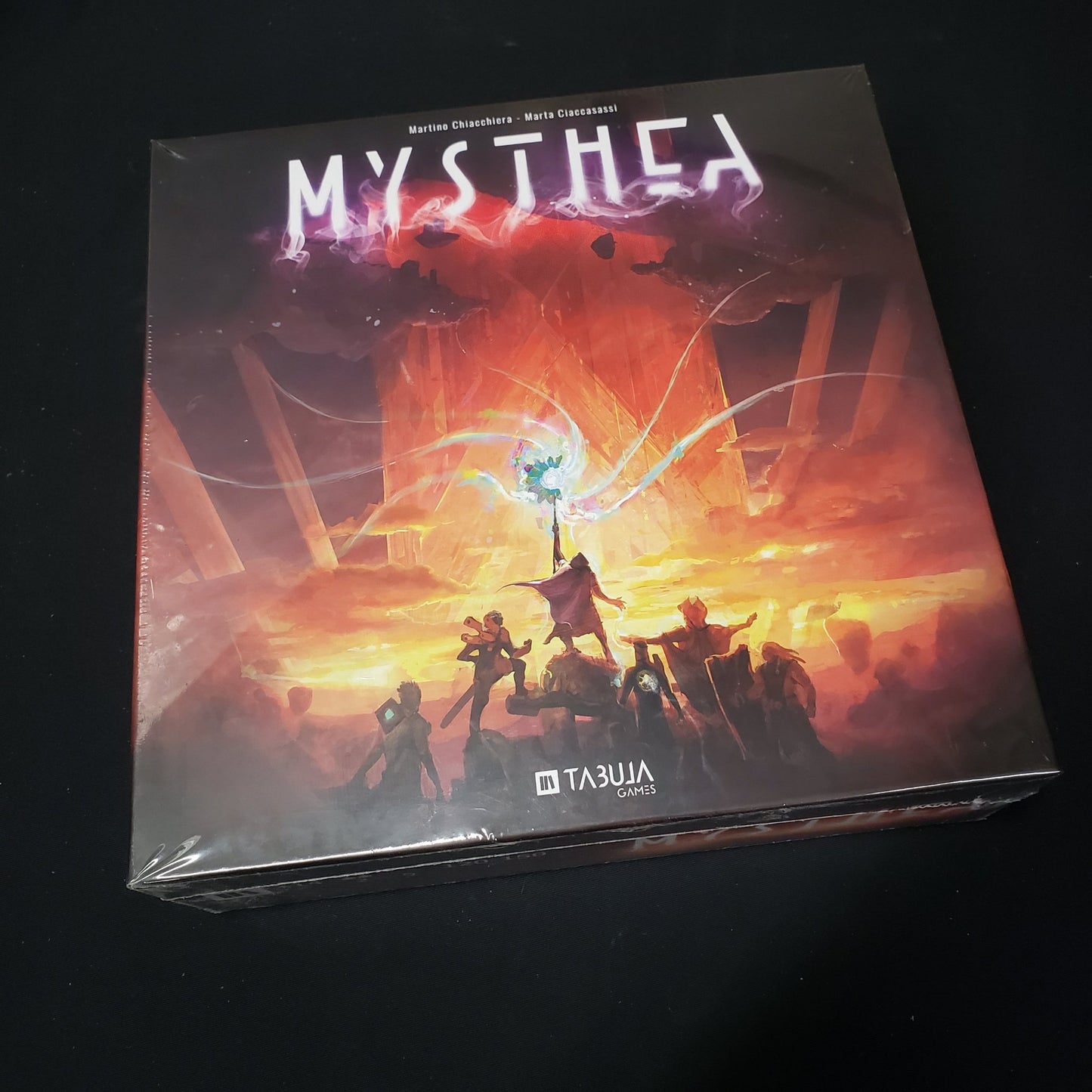 Image shows the front cover of the box of the Mysthea board game