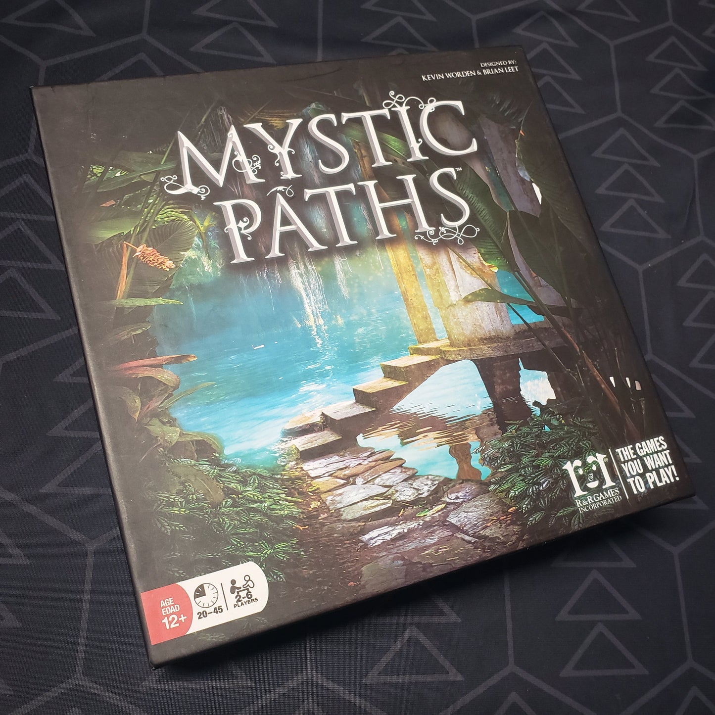 Image shows the front cover of the box for the Mystic Paths board game