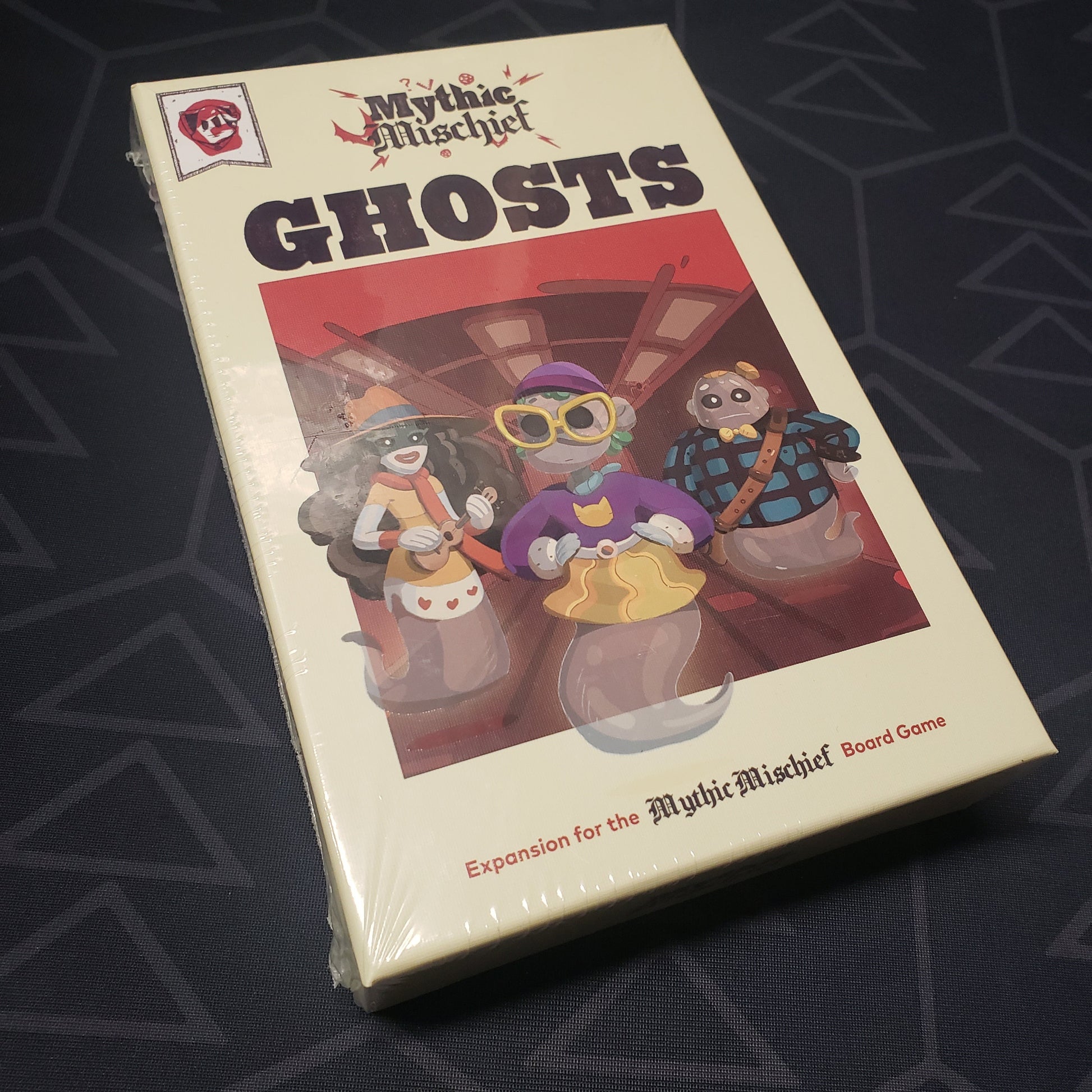 Image shows the front cover of the box of the Ghosts expansion for the board game Mythic Mischief